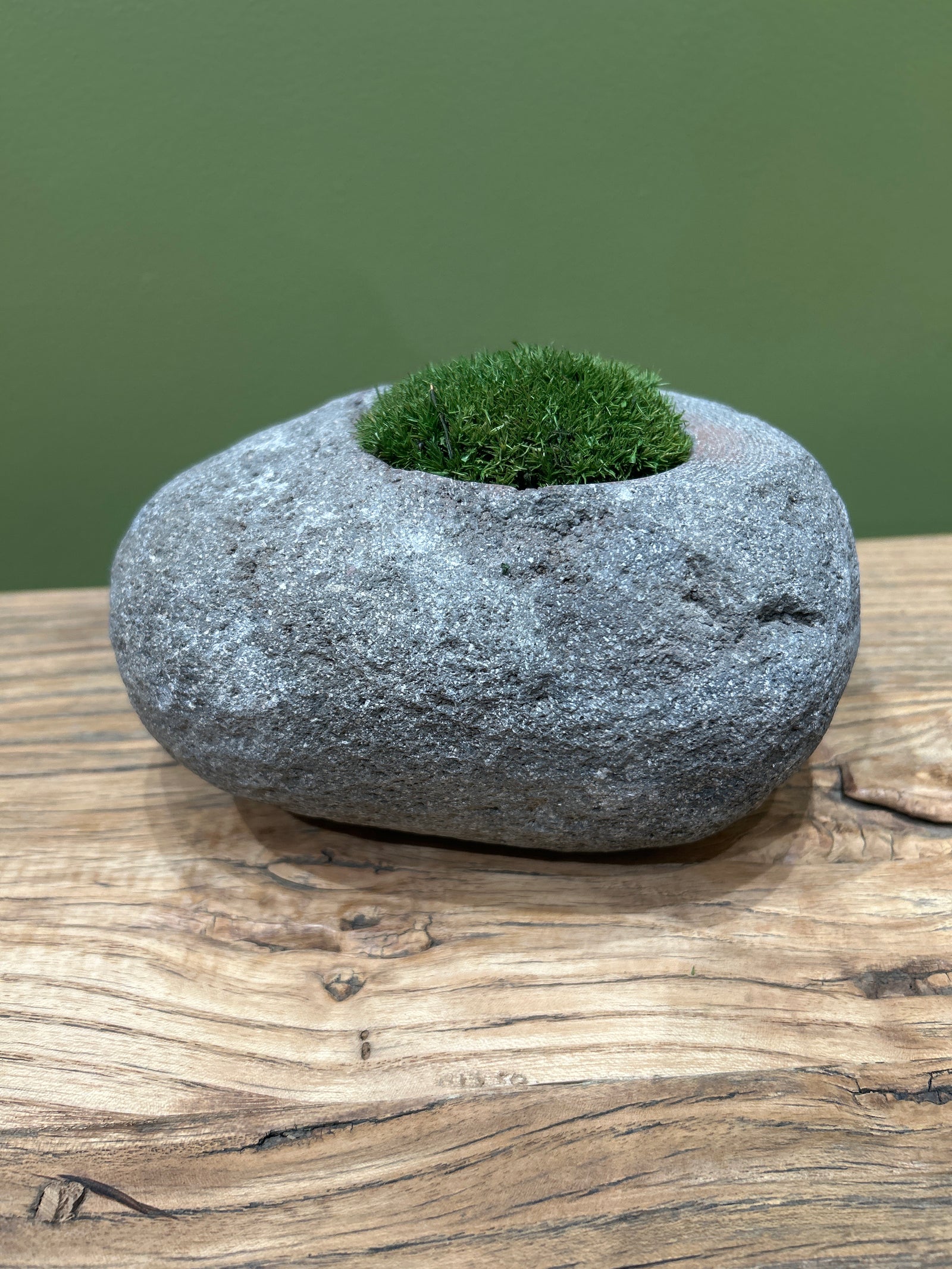 Hand-carved Indonesian riverstone filled with preserved moss