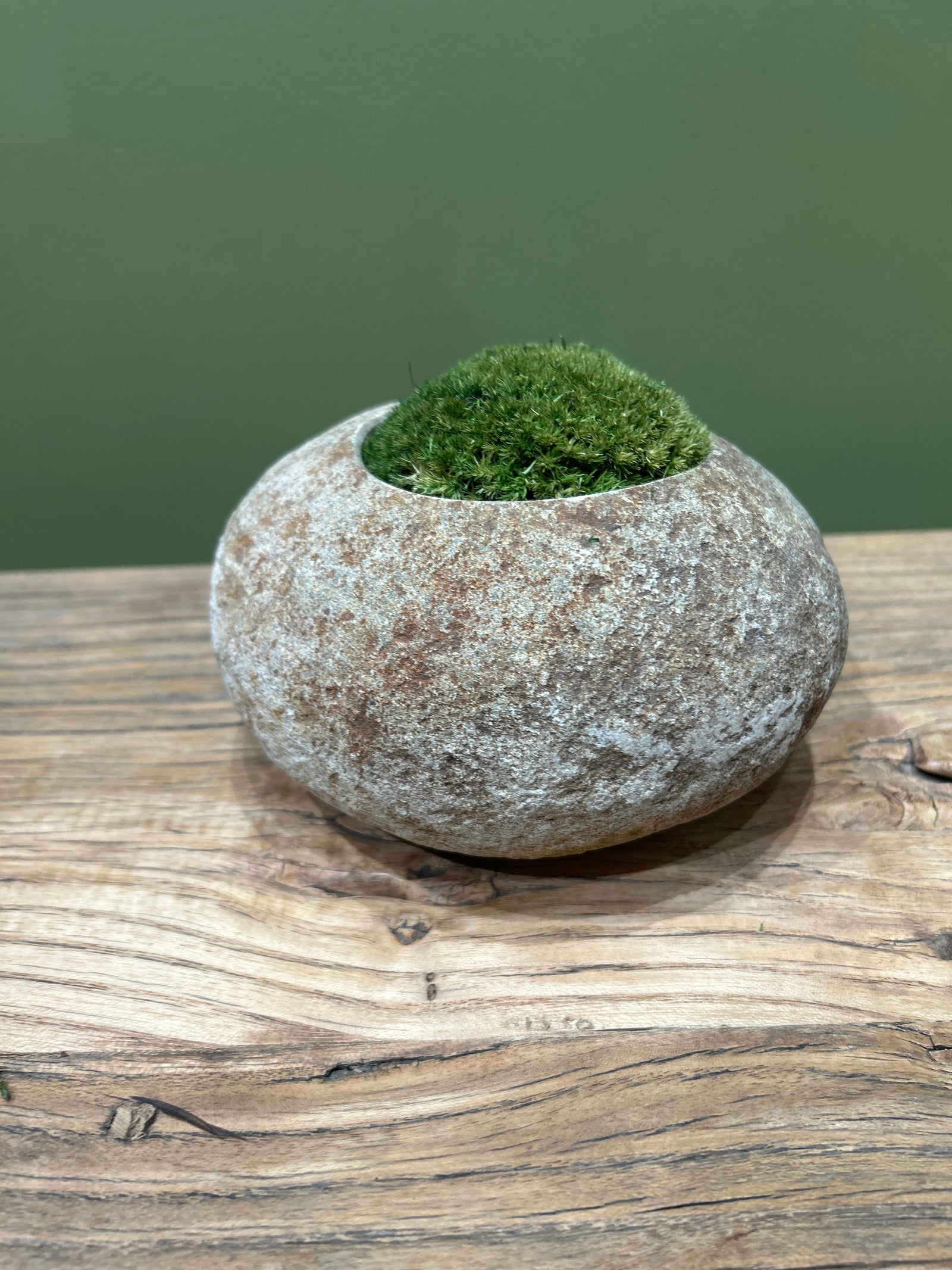 Hand-carved Indonesian riverstone filled with preserved moss