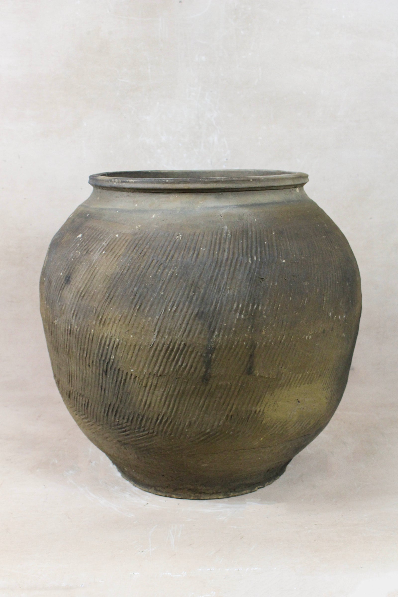 Vintage grey clay pot — side view showing the aged patina