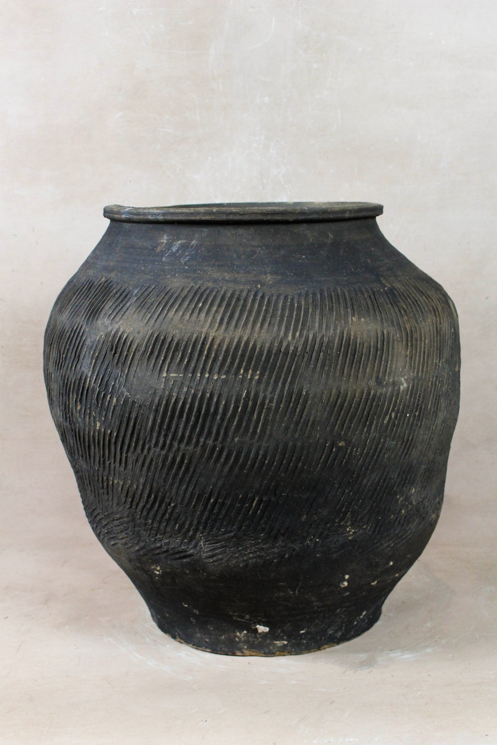 Vintage grey clay pot — side view showing the aged patina
