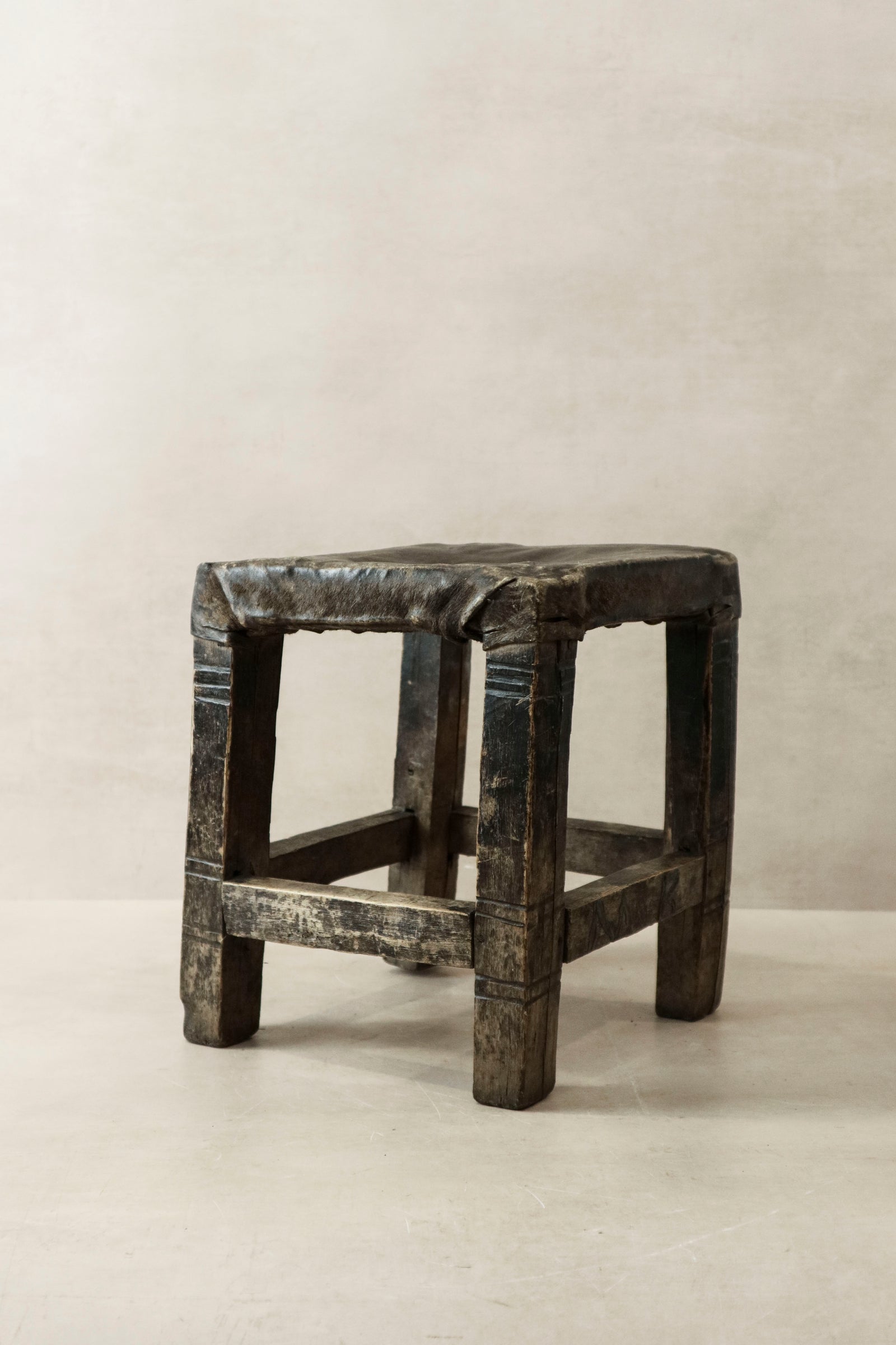 Vintage Chokwe hide-topped stool from central Africa