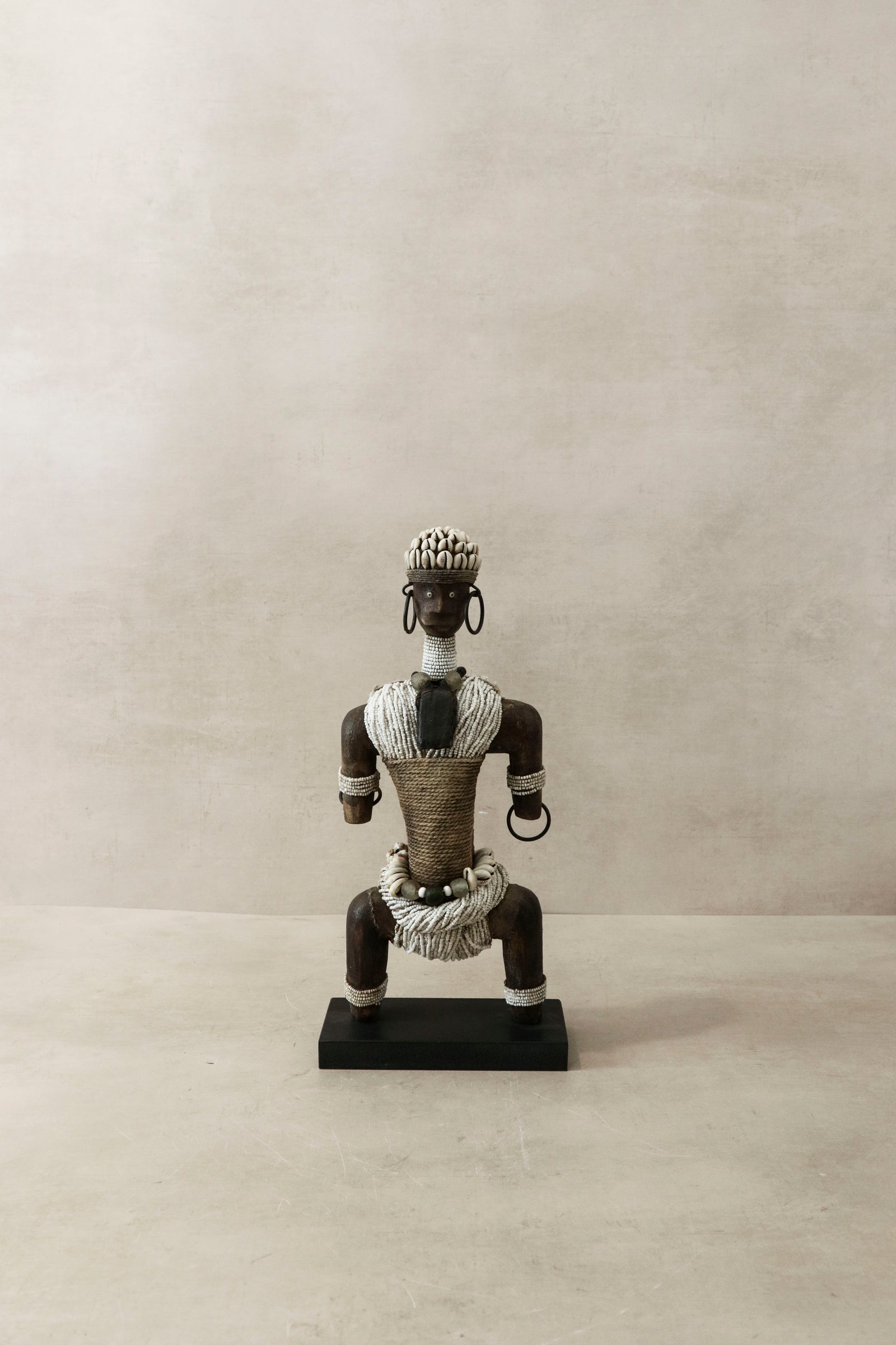 Hand-carved white beaded Namji doll from Cameroon