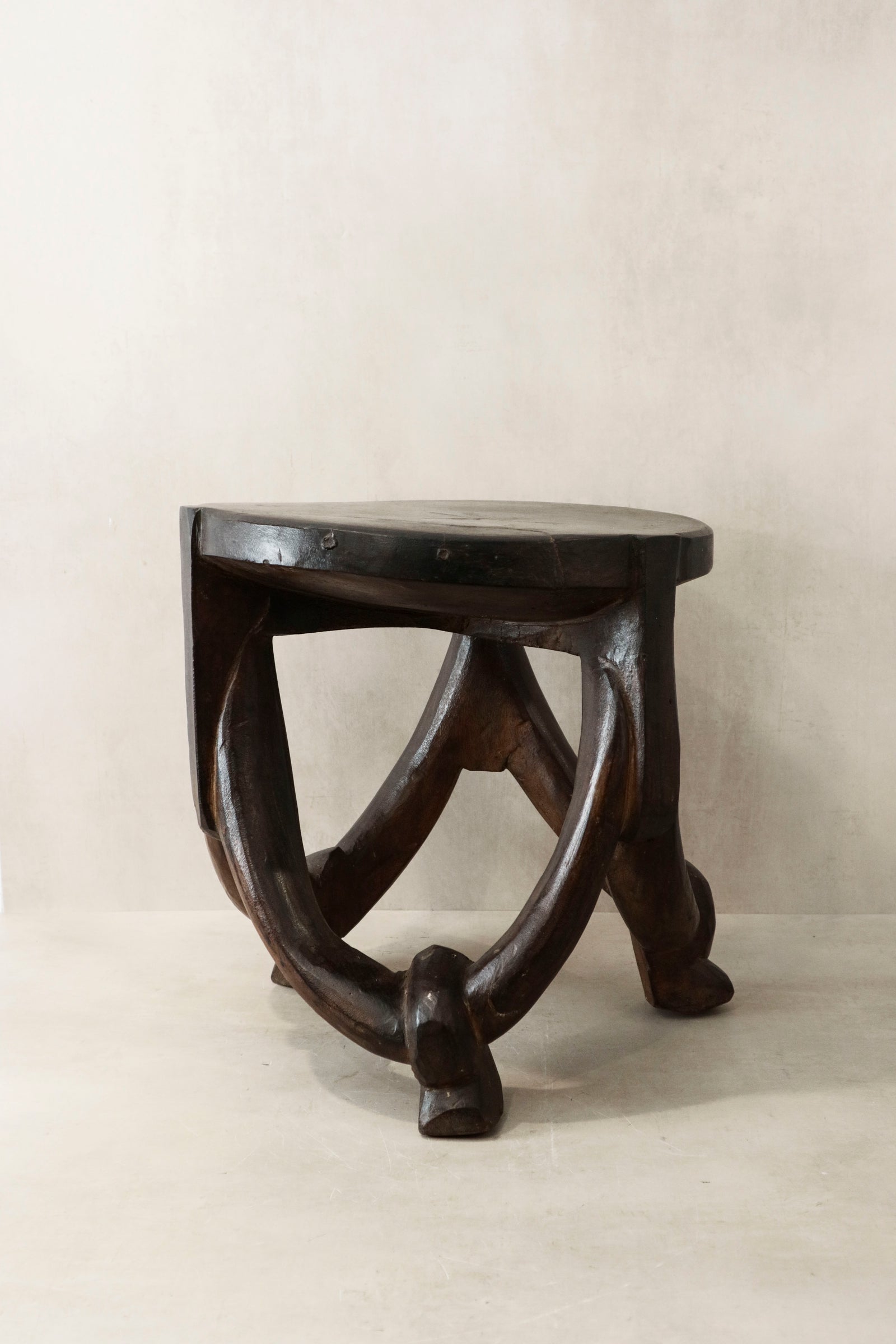Makonde carved wooden stool, Tanzania — side view