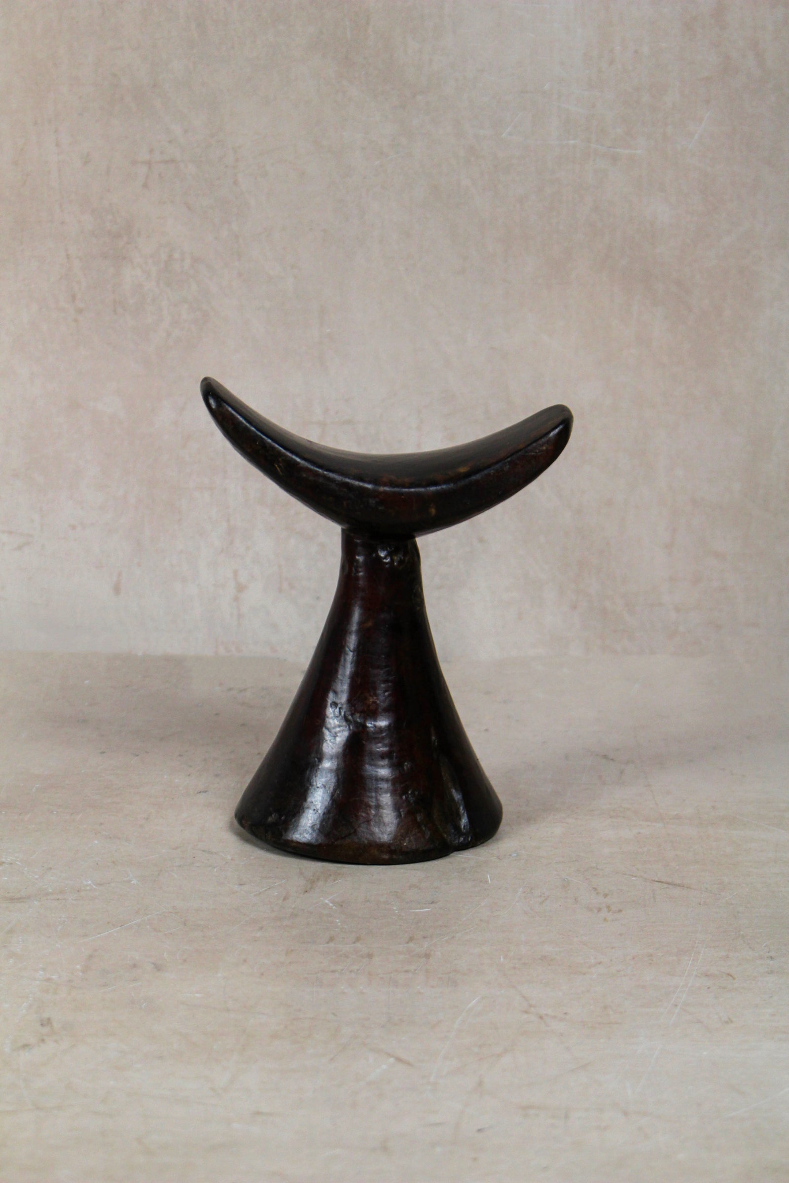 Vintage hand-carved Ethiopian wooden headrest in dark wood, sculptural African artefact (23.6)