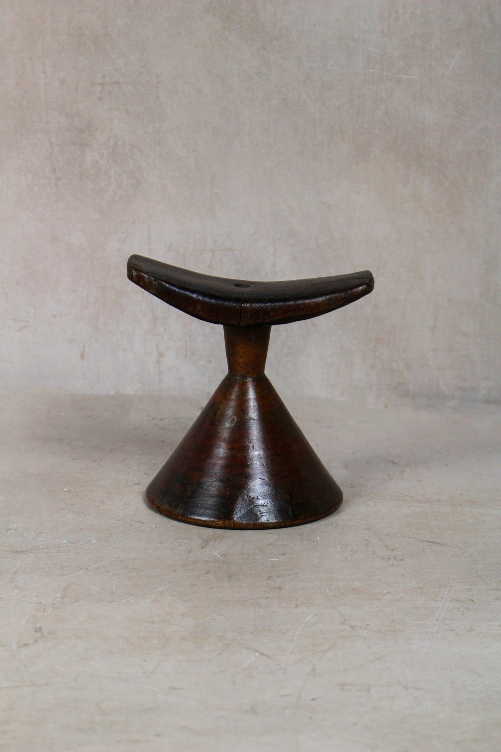 Vintage hand-carved Ethiopian wooden headrest in dark wood, sculptural African artefact (23.7)