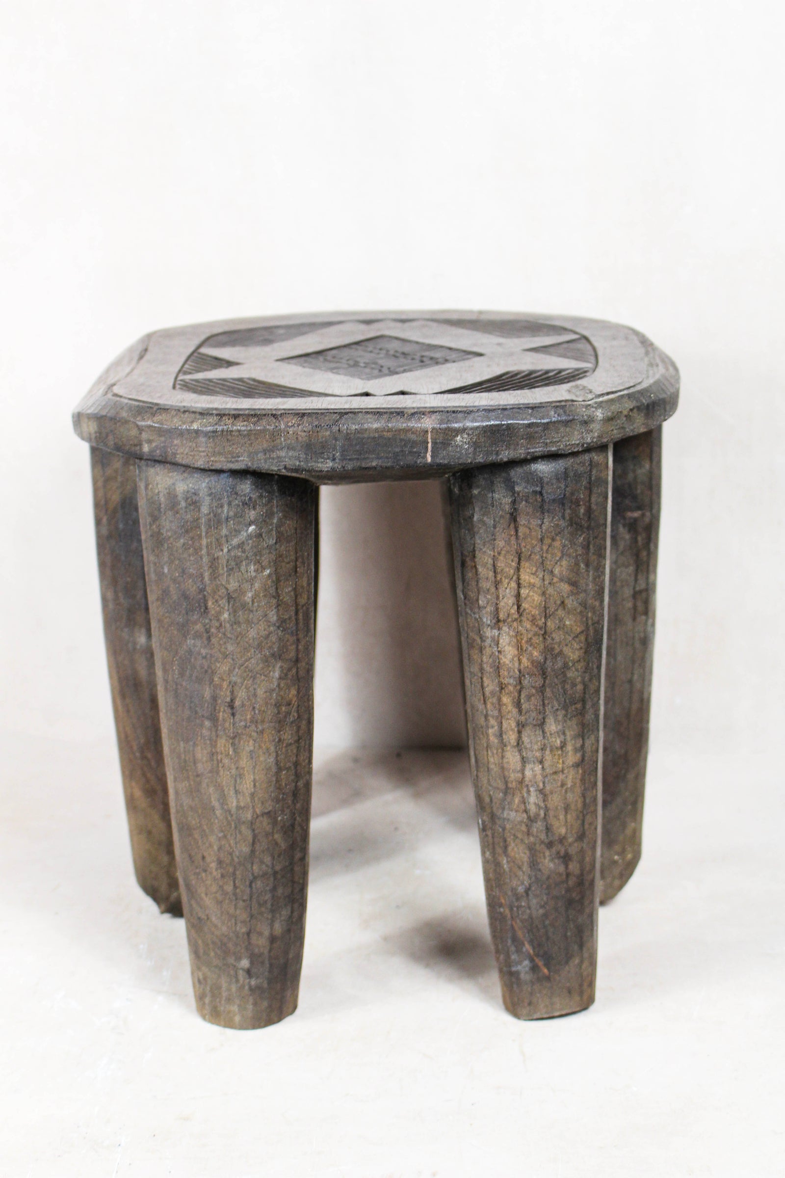 Nupe carved wood stool, Nigeria — top view