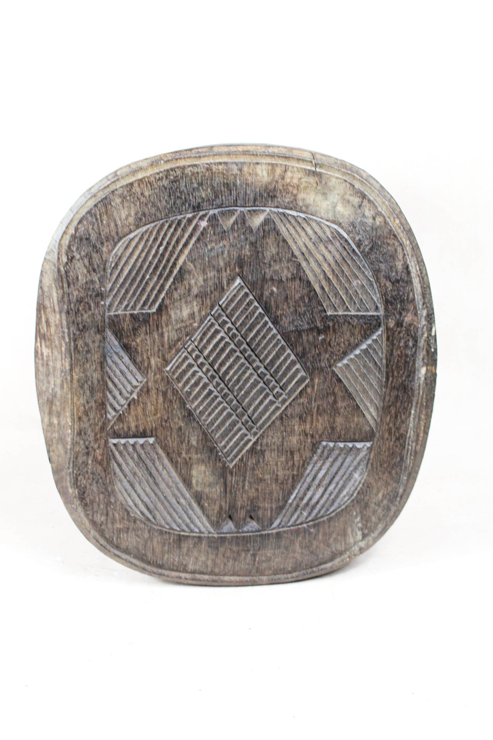 Nupe carved wood stool, Nigeria — side view
