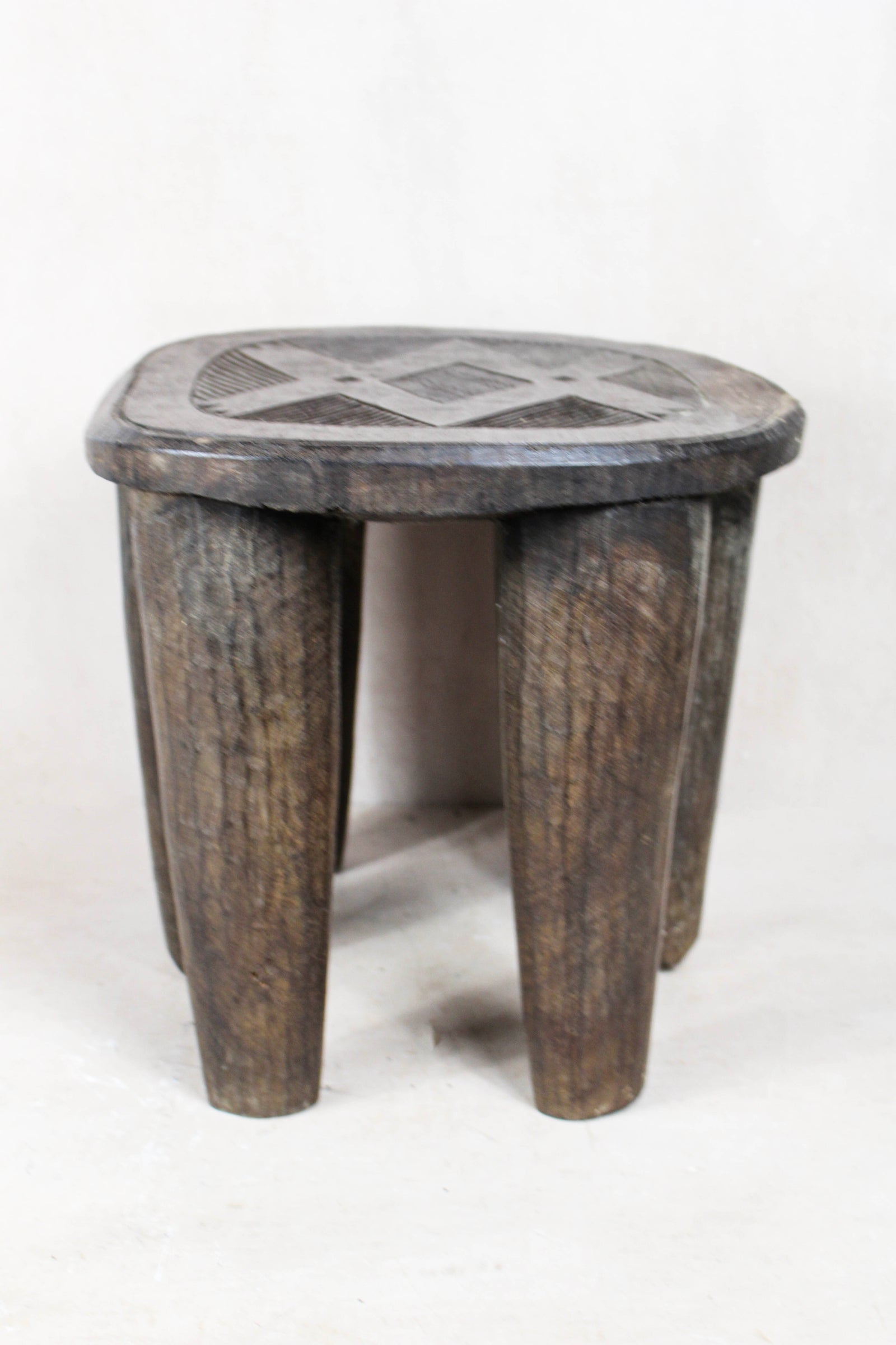 Nupe carved wood stool, Nigeria — top view