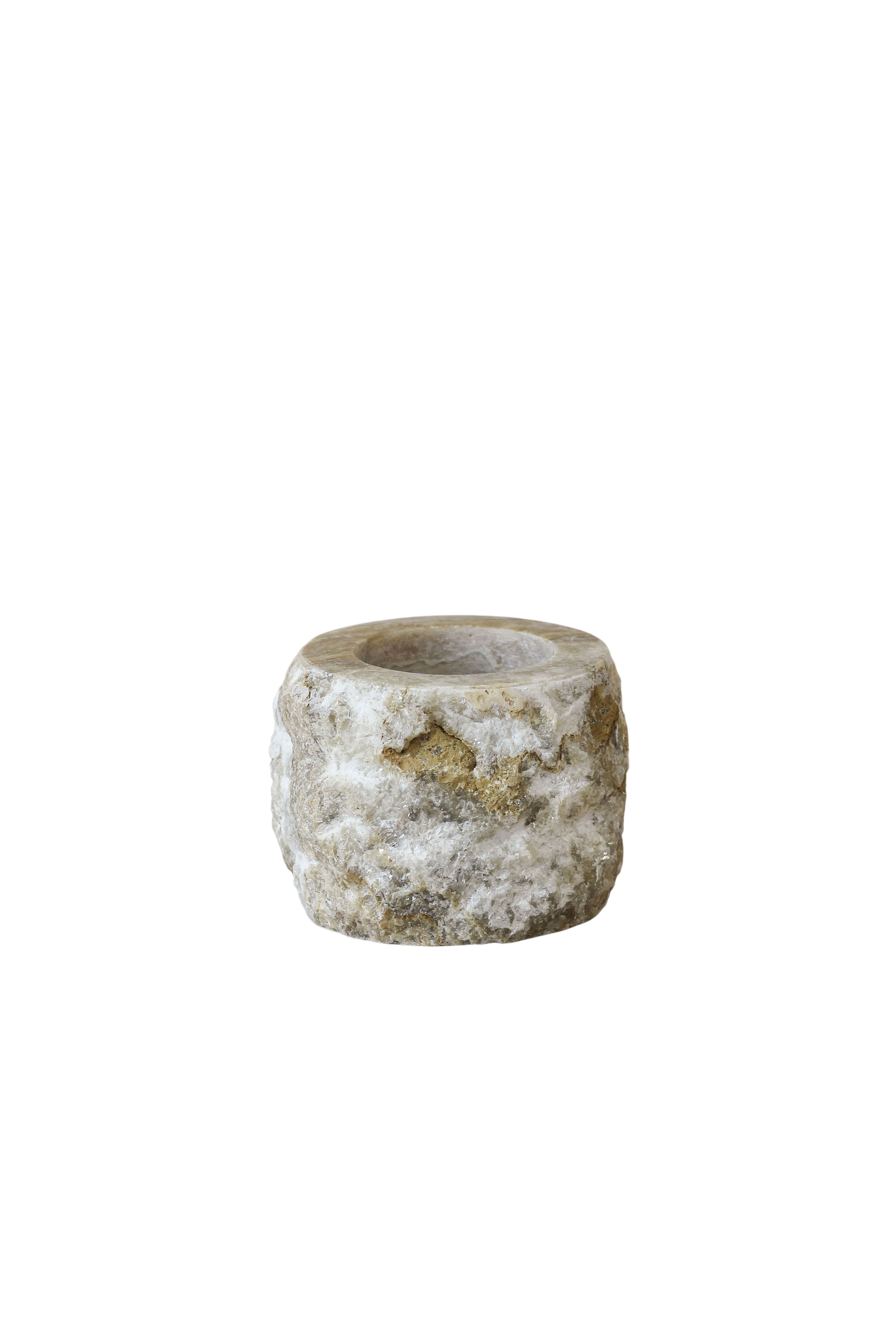 Rough-cut onyx candle holder with polished top and raw natural sides