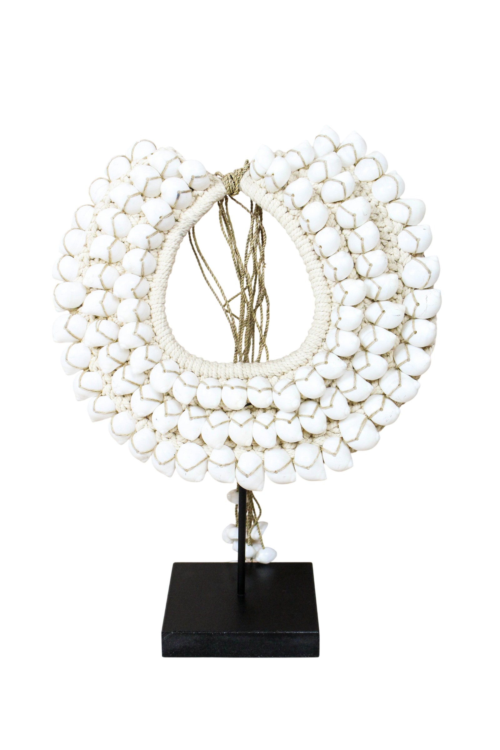 Handmade Indonesian white shell necklace on a display stand