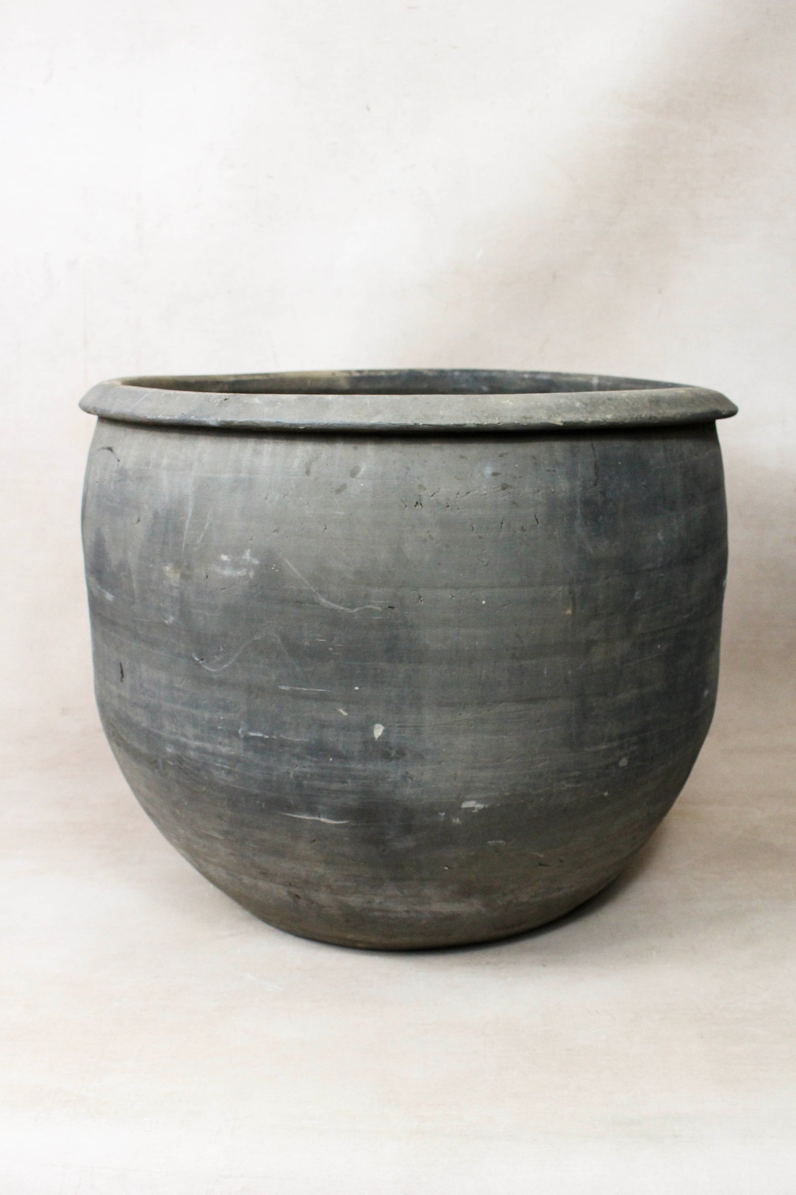 Large vintage dark clay pot — opening from above