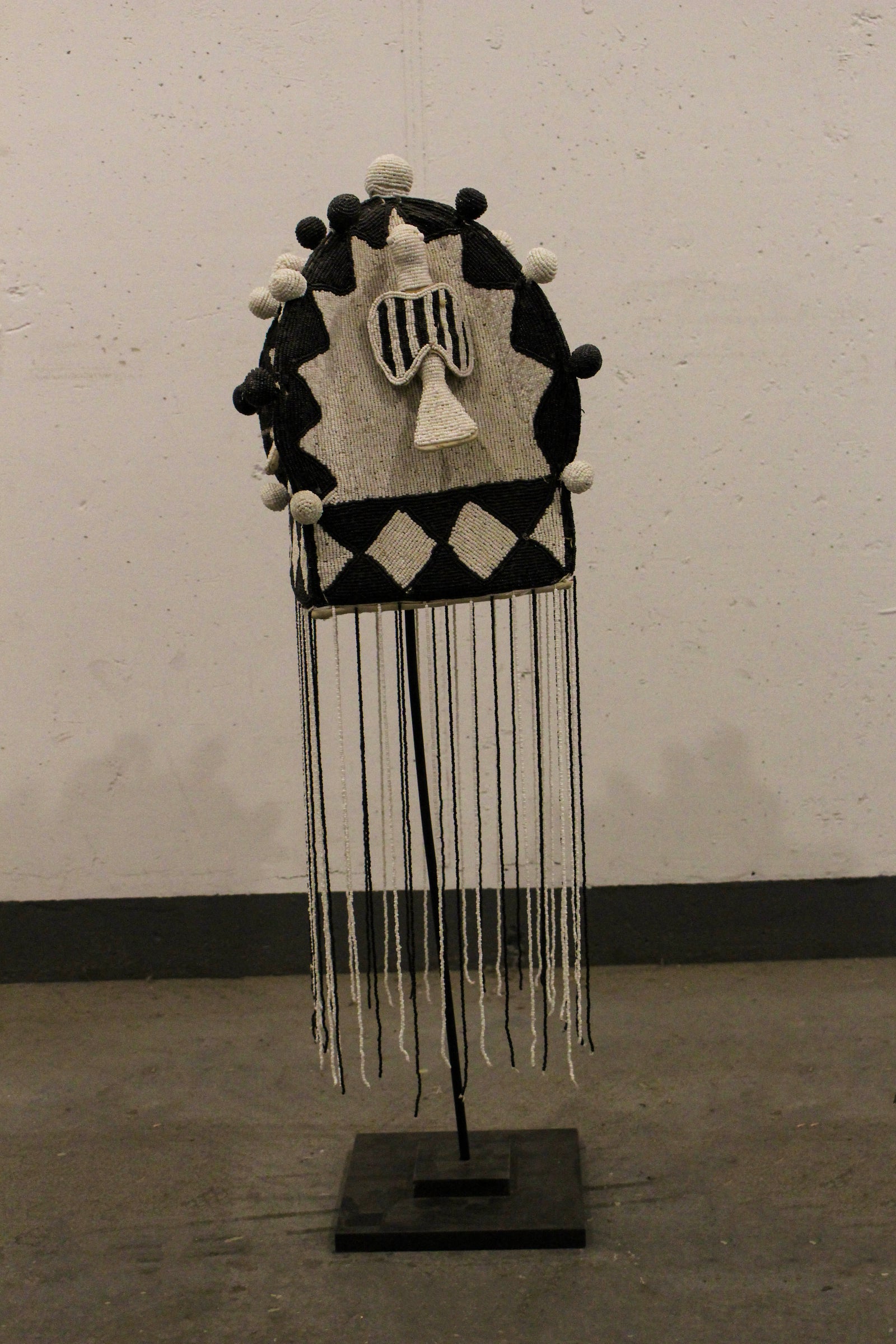 Yoruba royal beaded crown in black and white, front view