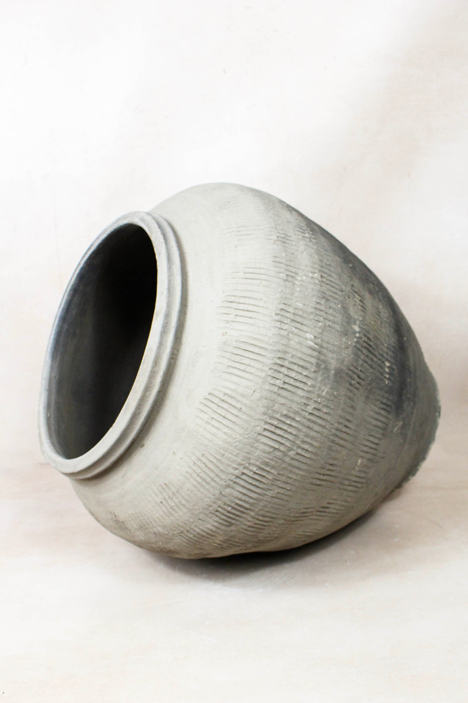 Vintage grey clay pot — opening from above