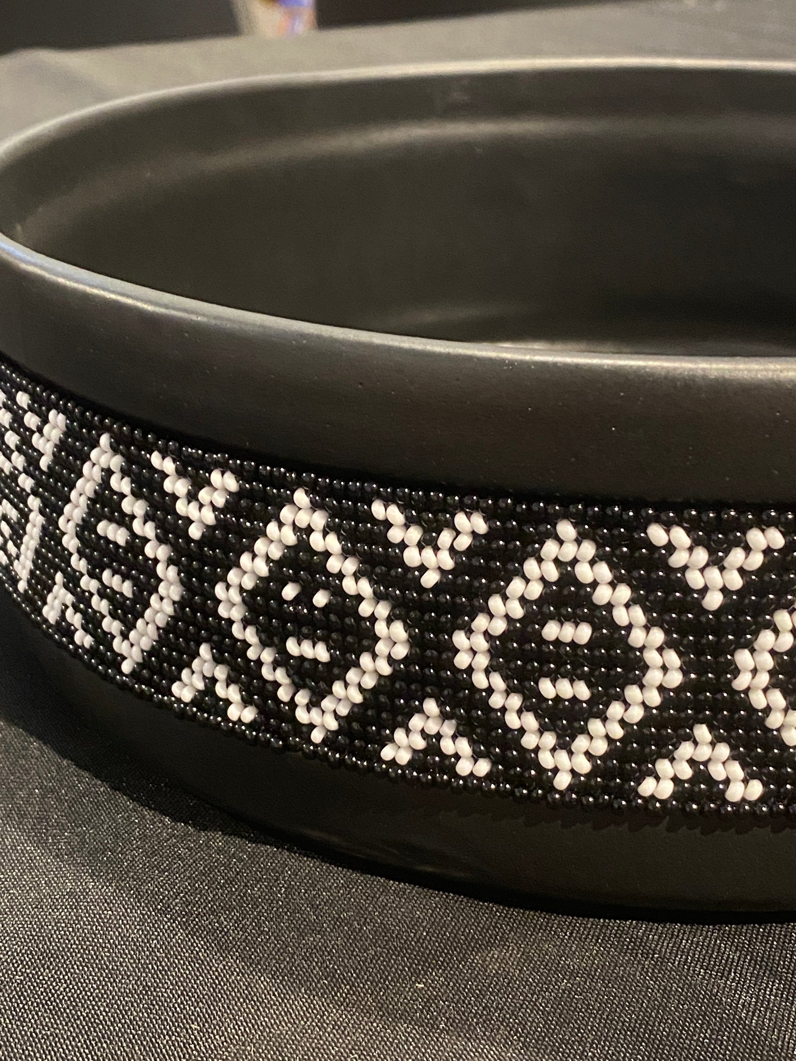Contemporary ceramic bowl with a handmade glass beaded band around the rim