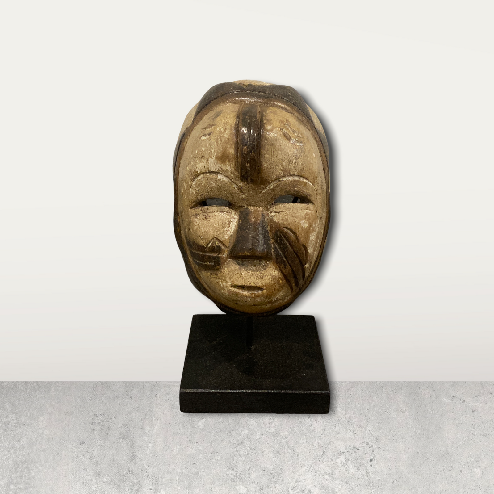 Small African mask on stand