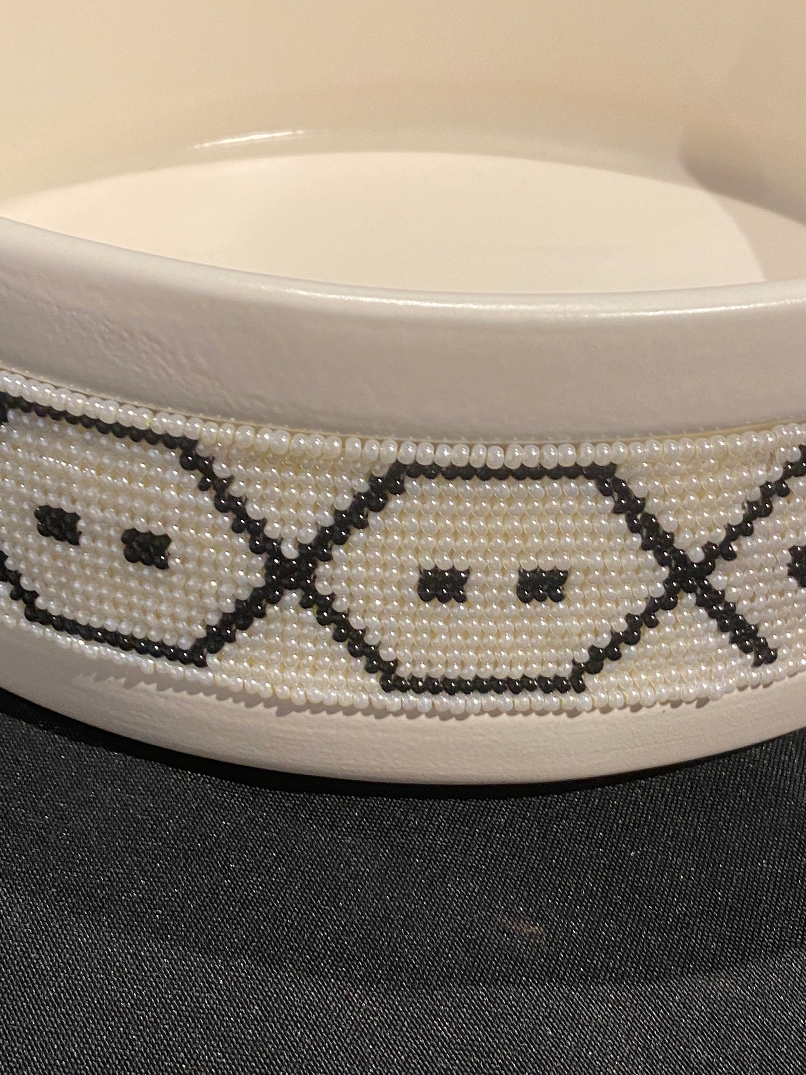 Contemporary ceramic bowl with a handmade glass beaded band around the rim