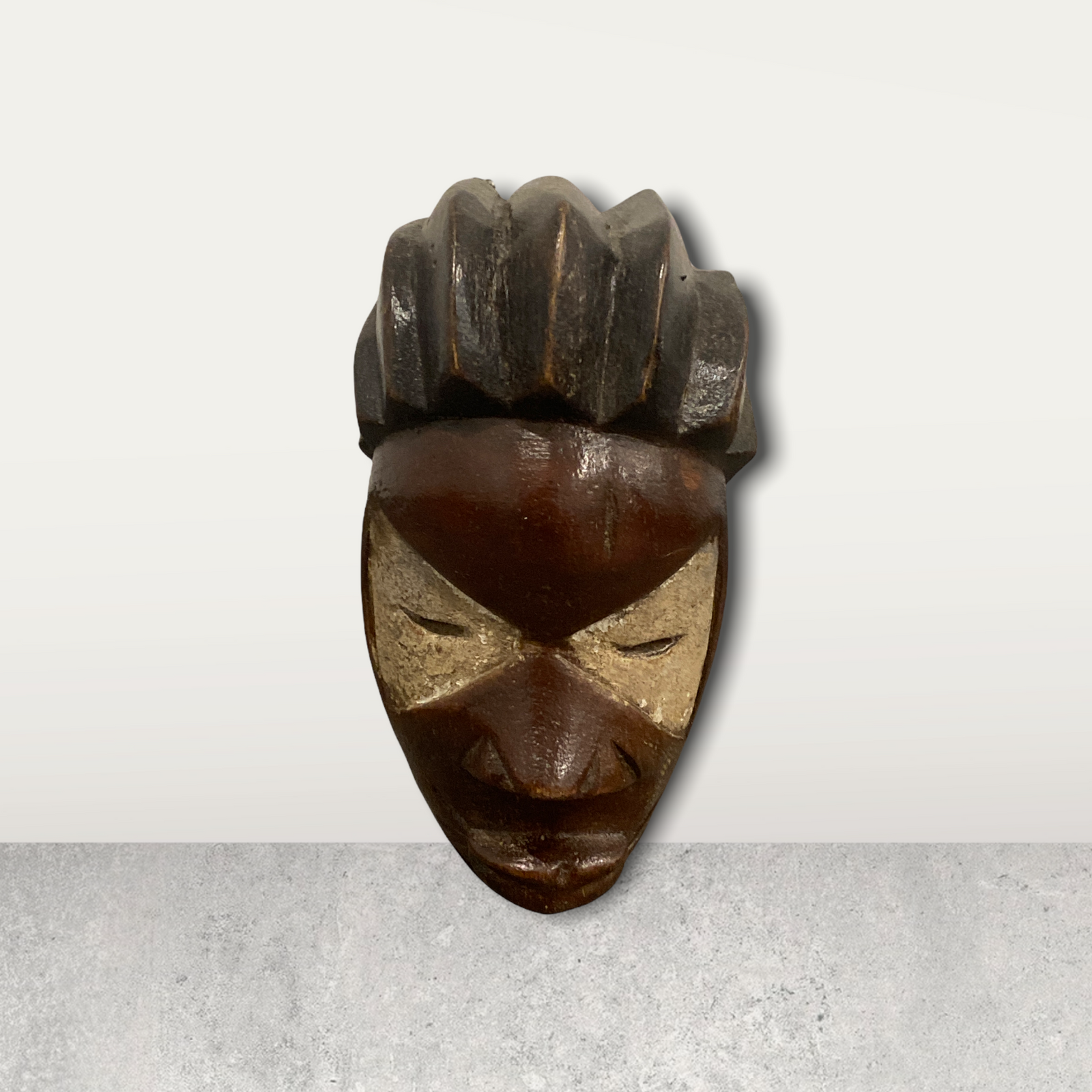 Small African mask on stand
