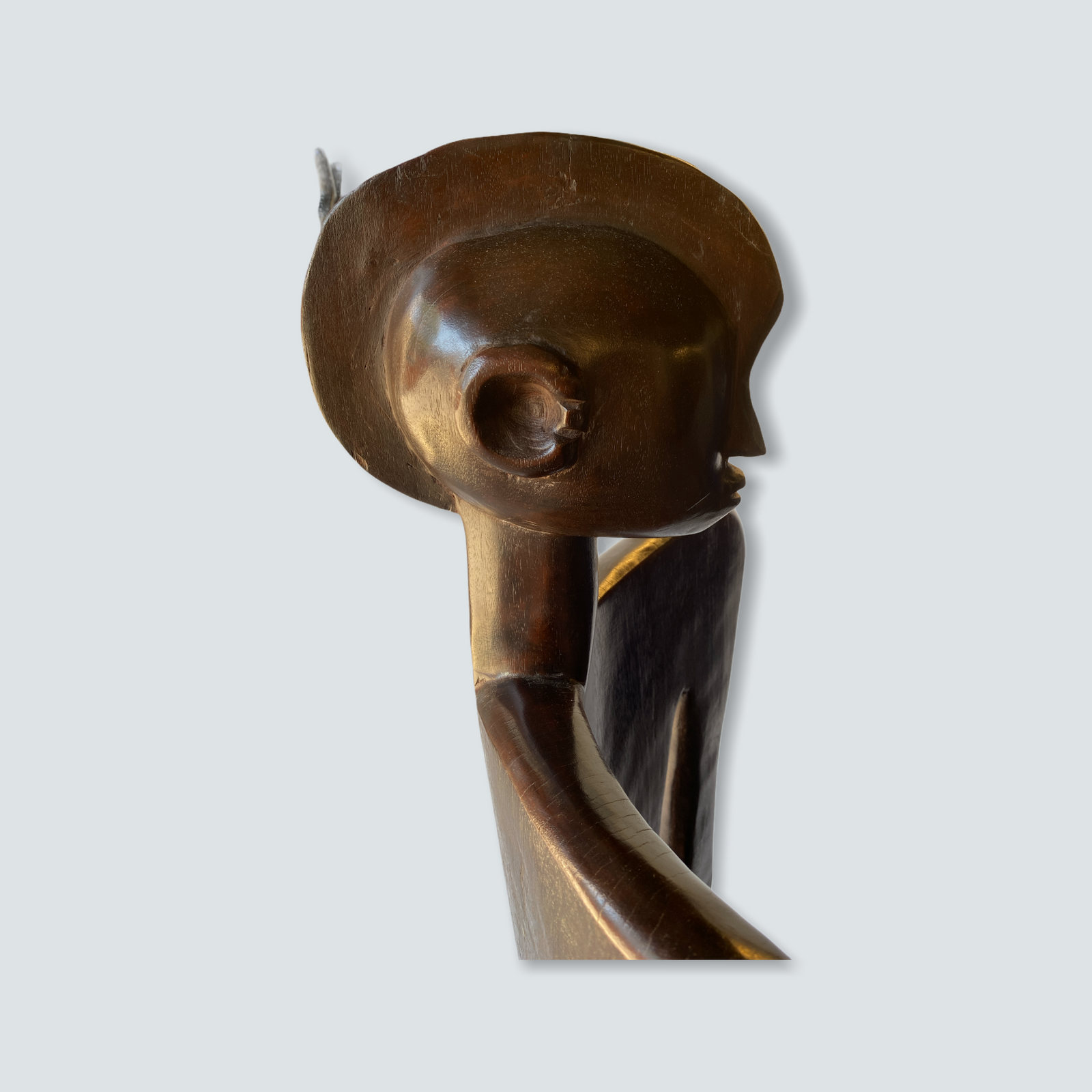 Detail of hands carved into the backrest of the Makonde chair