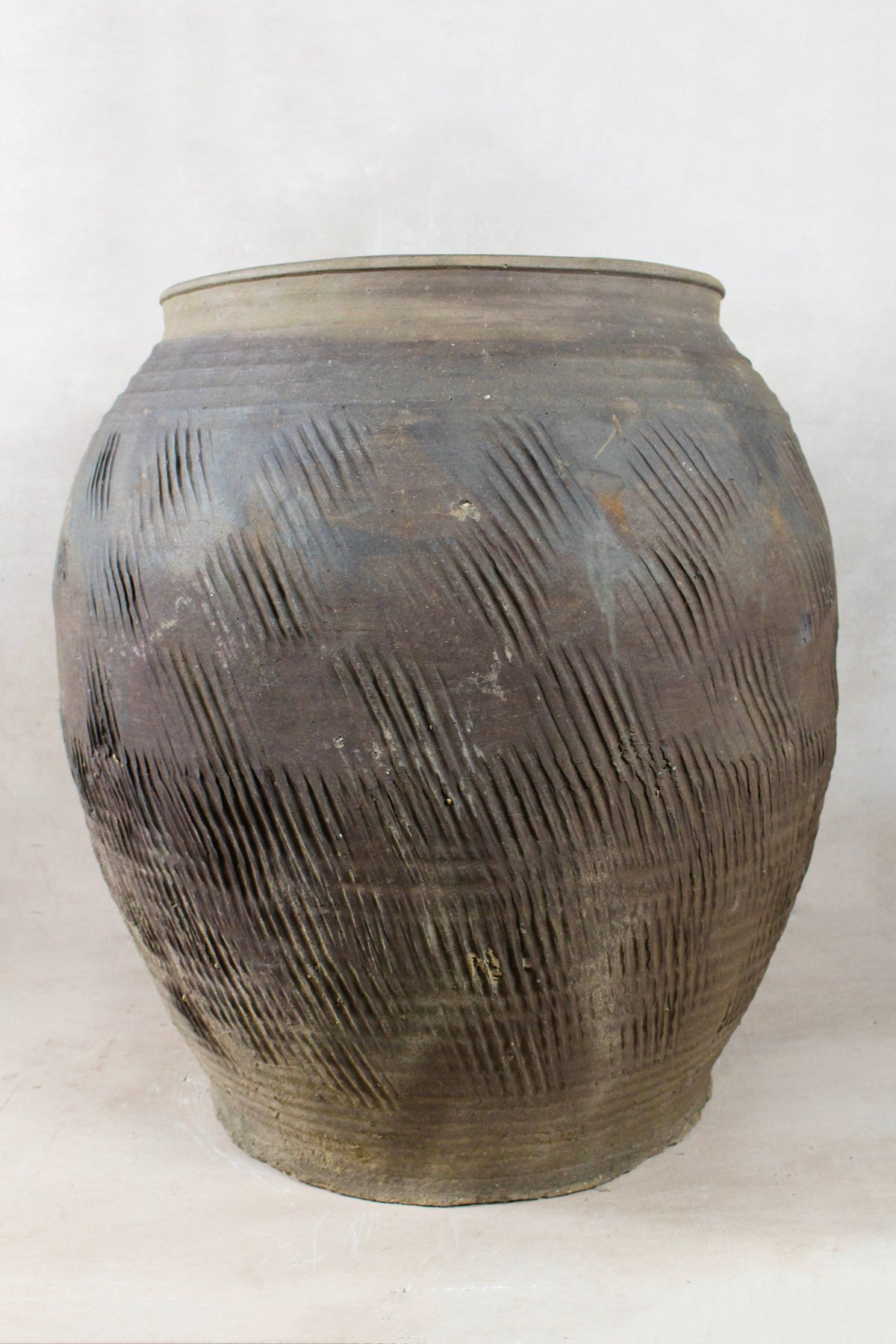 Large vintage dark unglazed earthenware storage jar, ideal as a statement floor planter