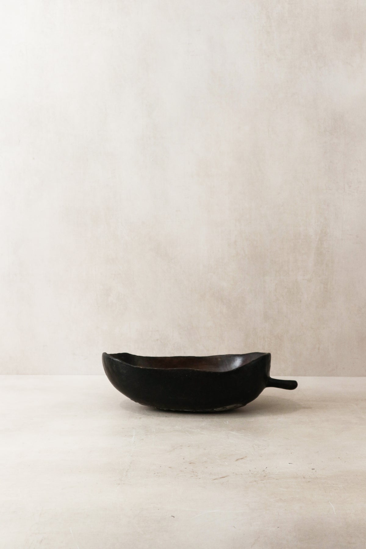 Tutsi bowl — side view showing the carved form