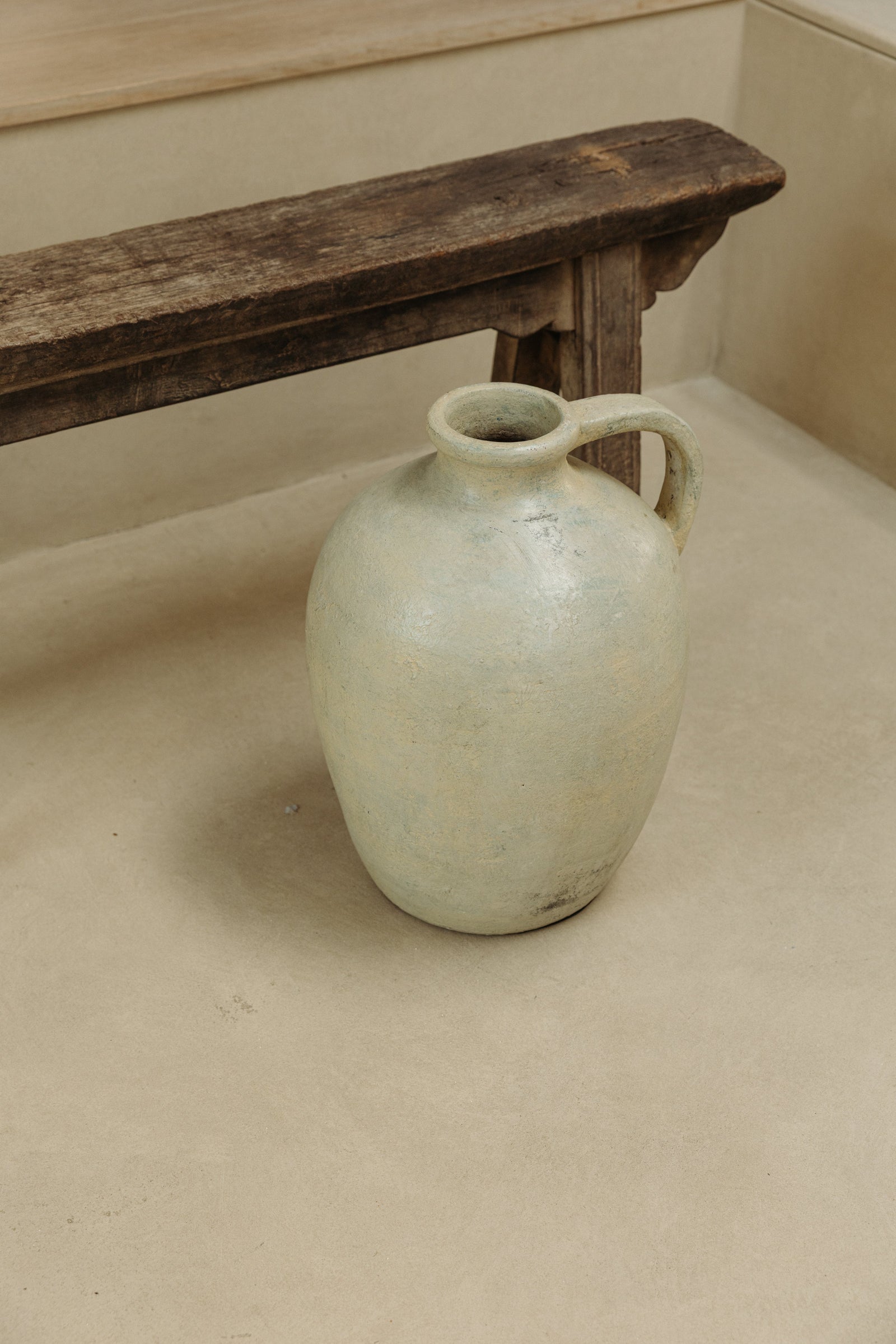 Light green glazed Indonesian vase with an antiqued brutalist form
