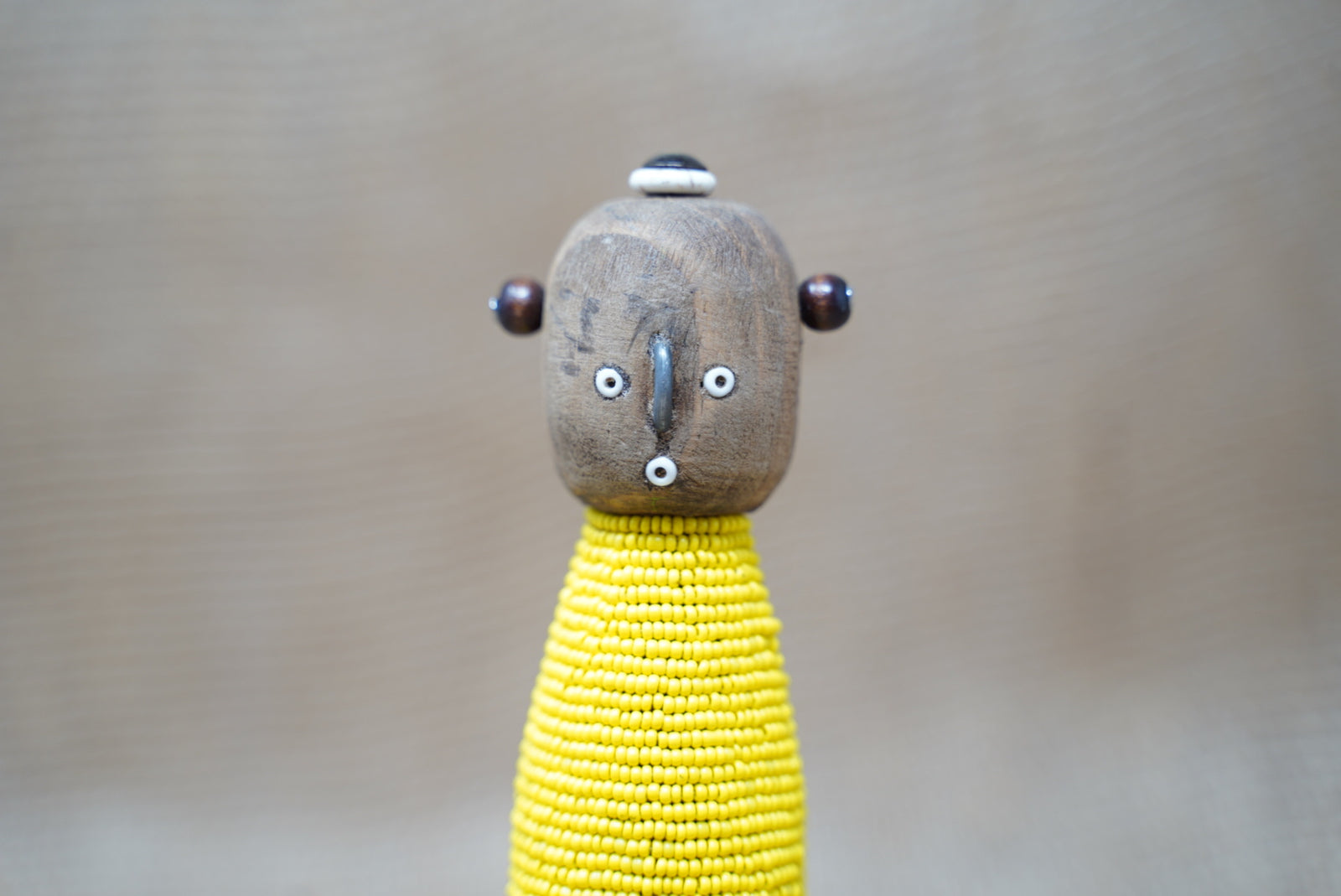 Yellow Namji baby doll — side view