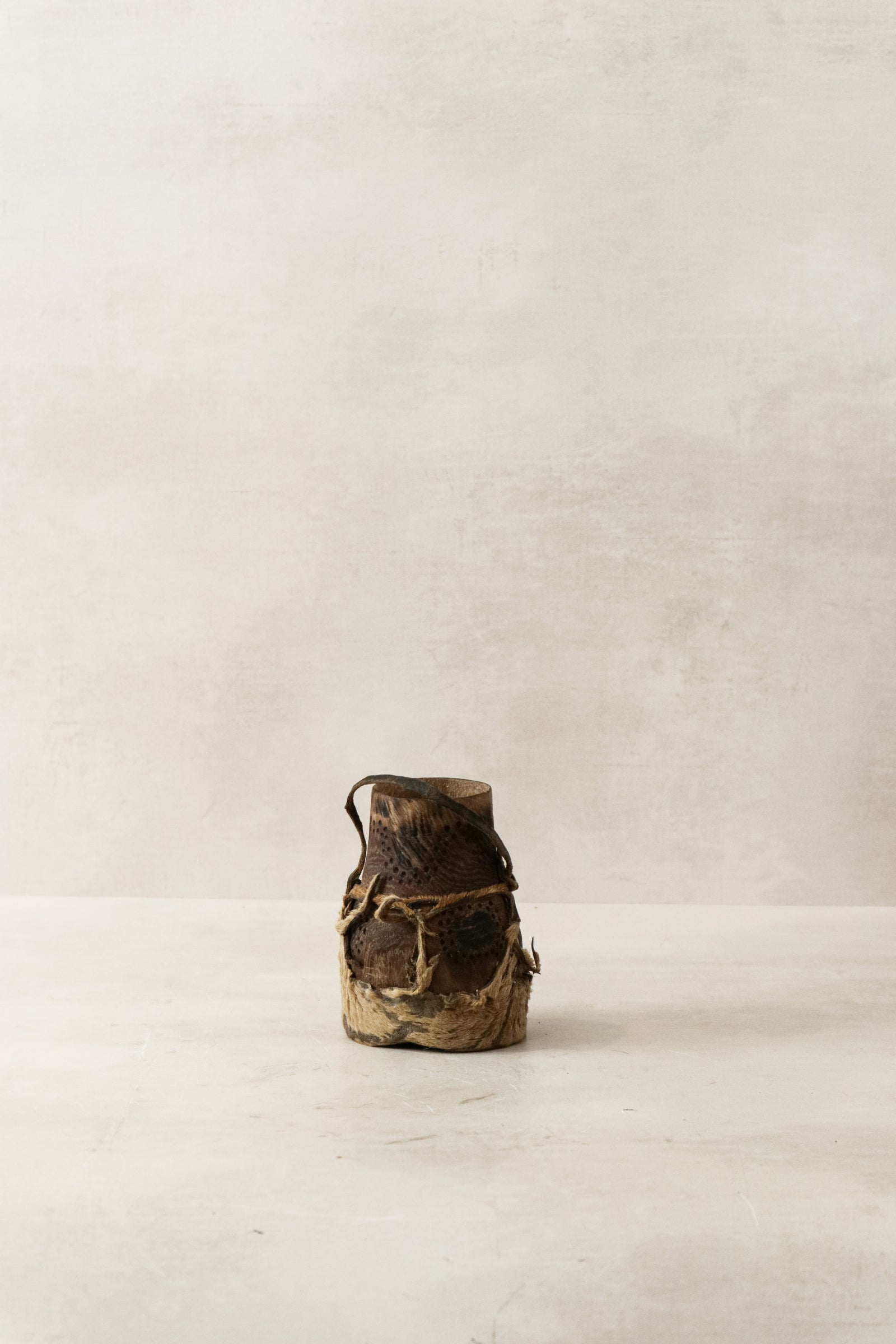 Vintage Turkana honey pot hand-carved in Kenya with goat-leather detail