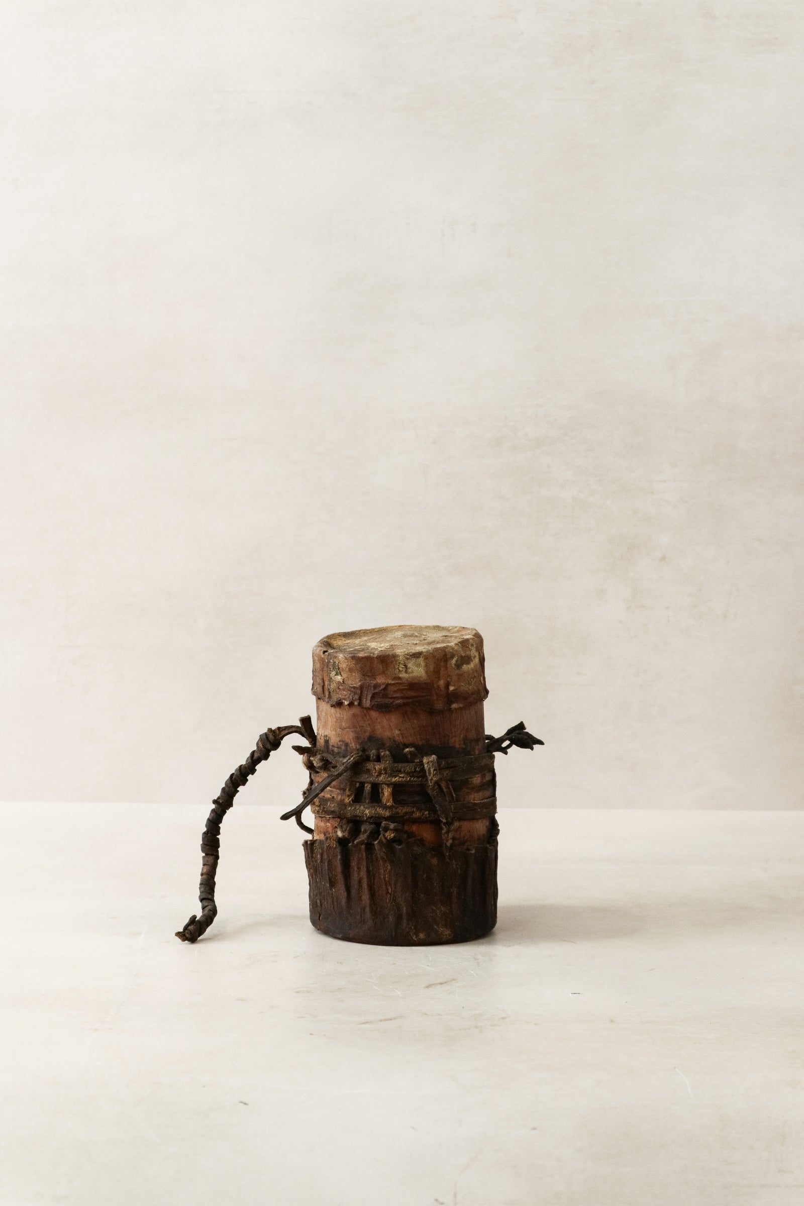 Vintage Turkana honey pot hand-carved in Kenya with goat-leather detail