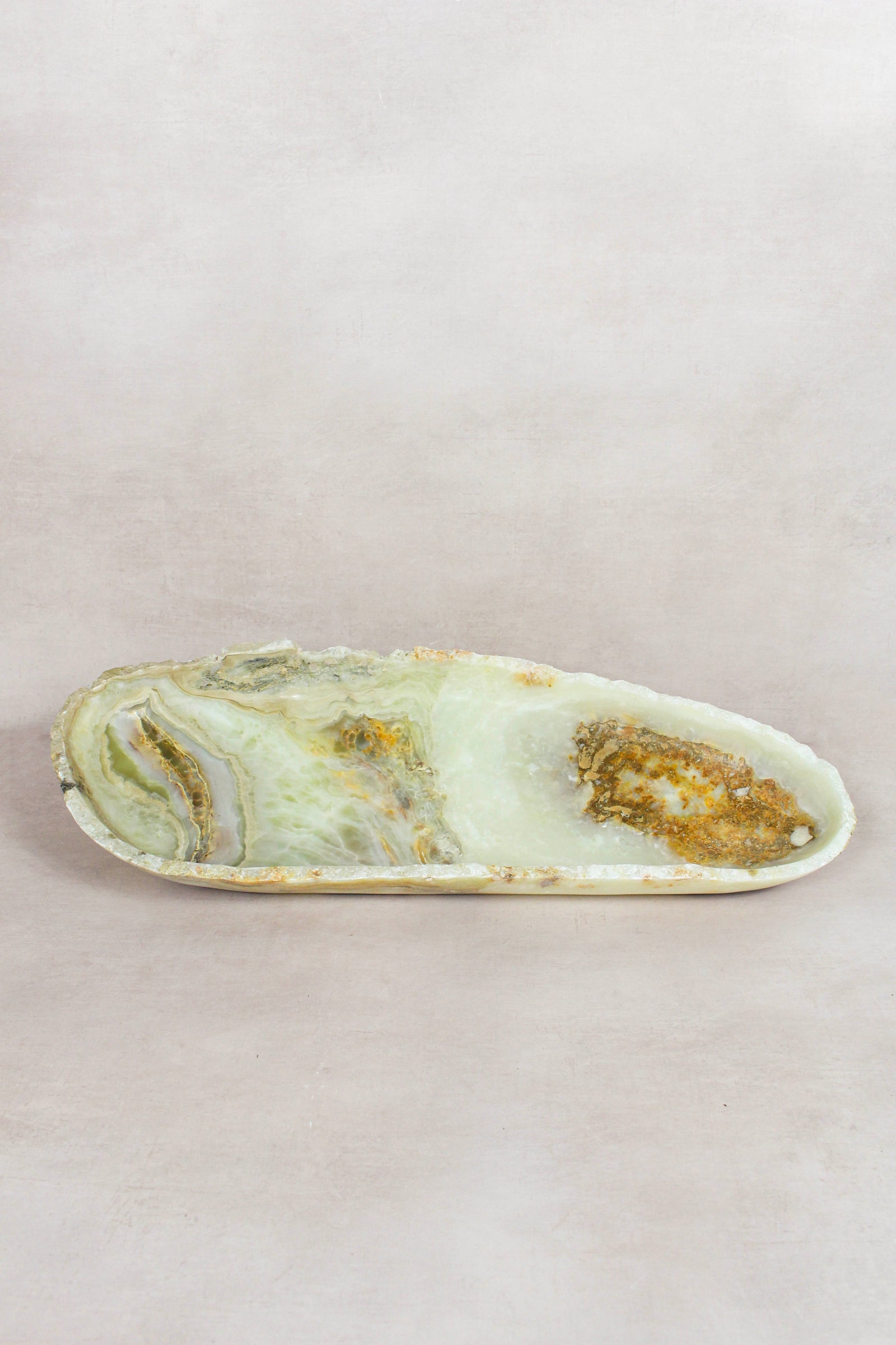 Raw-edge onyx bowl hand-carved from natural stone