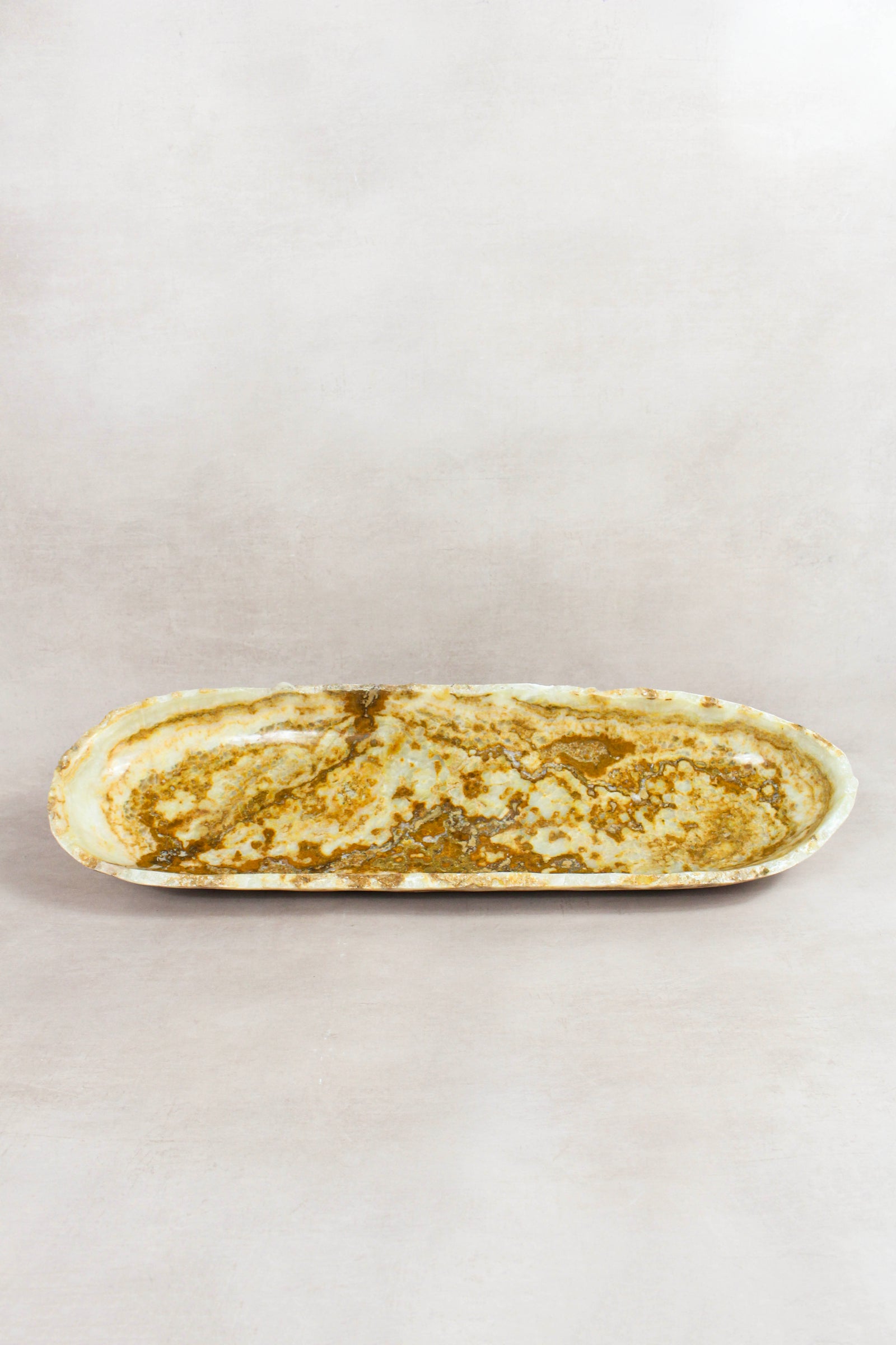 Raw-edge onyx bowl hand-carved from natural stone