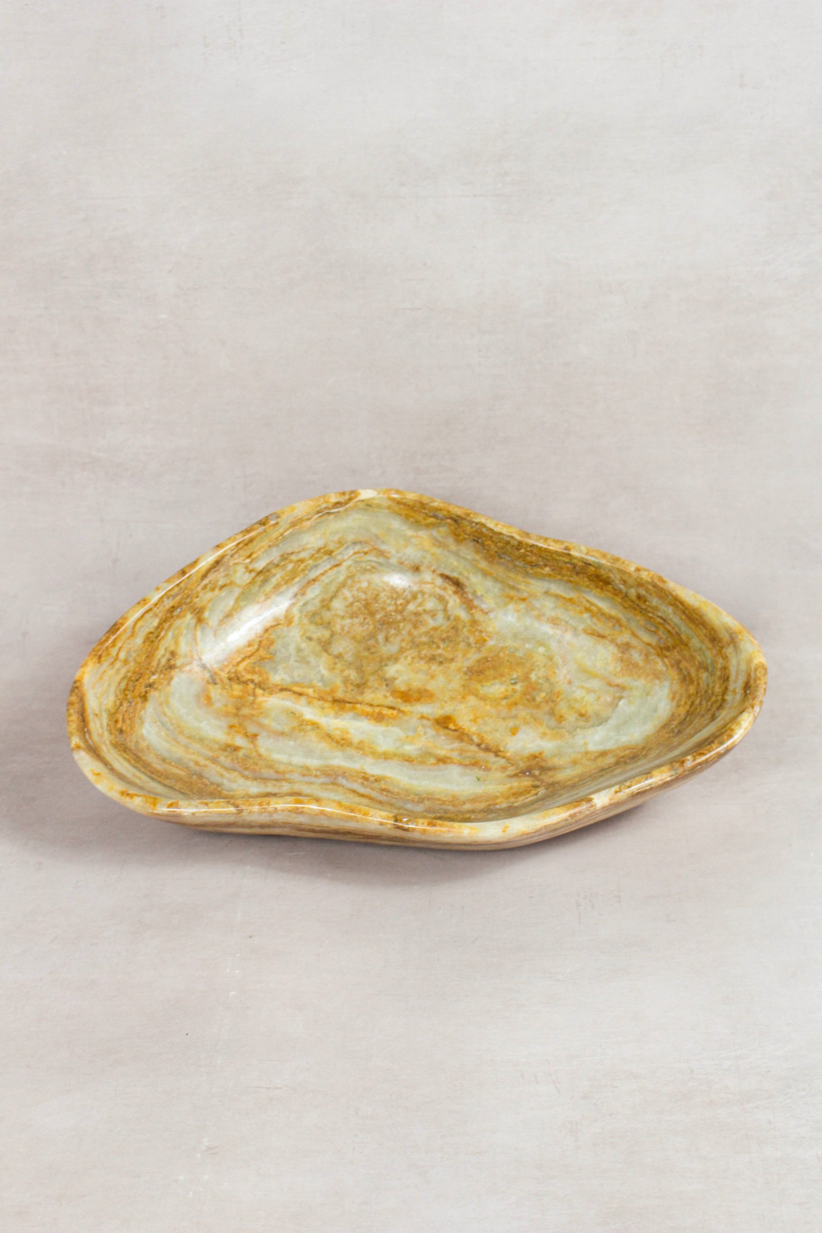 Raw-edge onyx bowl hand-carved from natural stone