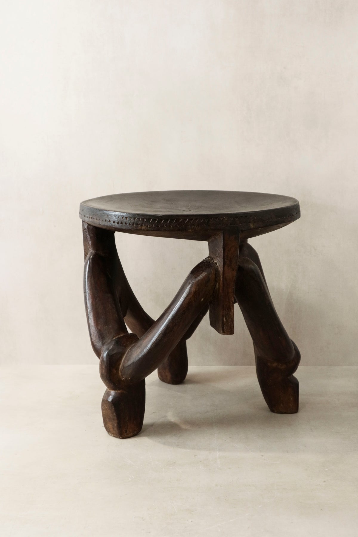 Makonde carved wooden stool, Tanzania — side view