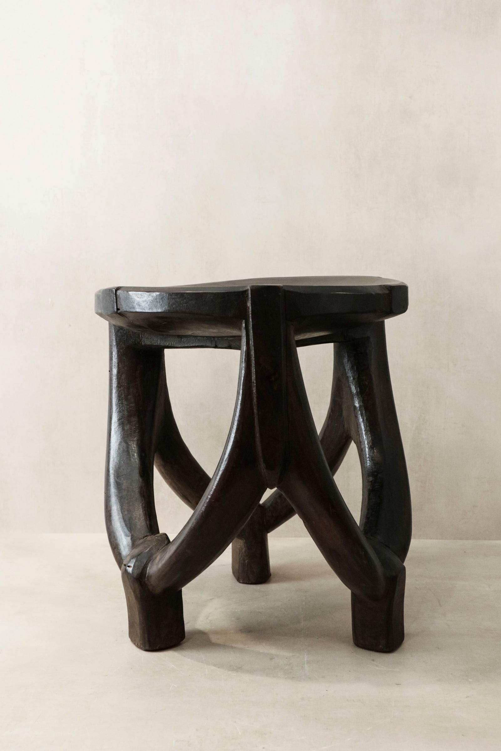 Hand-carved Makonde stool from Tanzania, carved from a single piece of wood