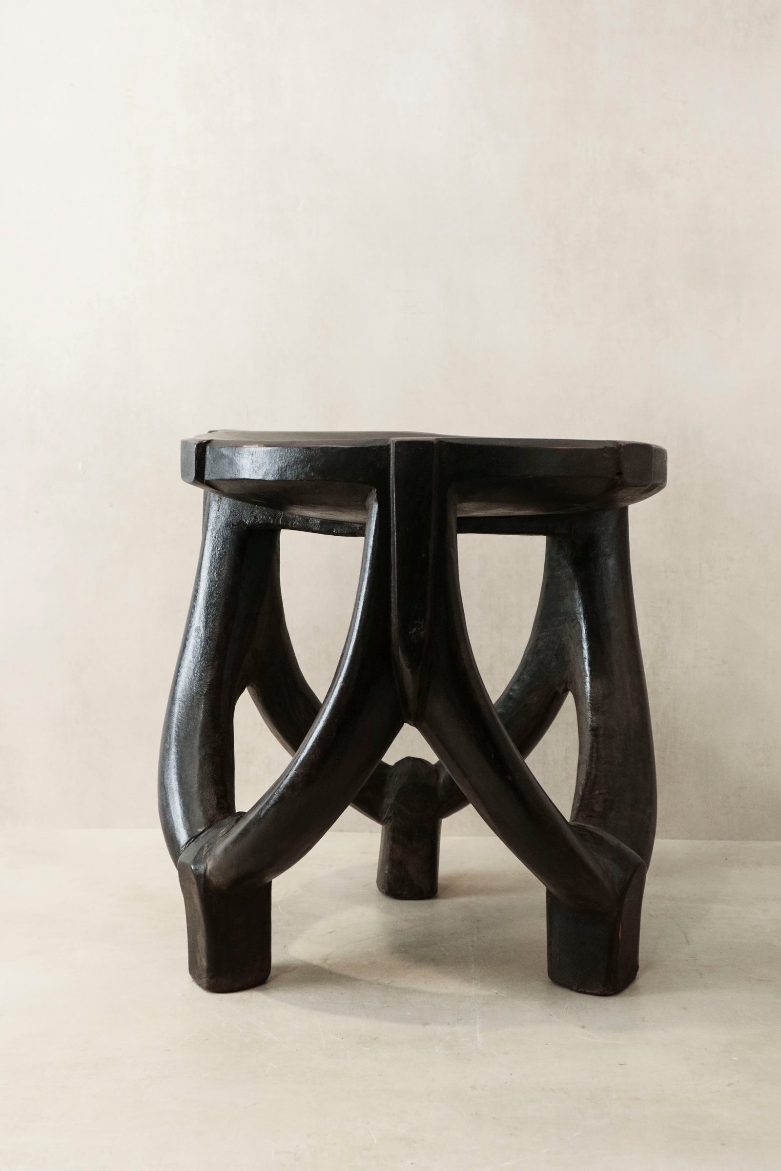 Hand-carved Makonde stool from Tanzania, carved from a single piece of wood