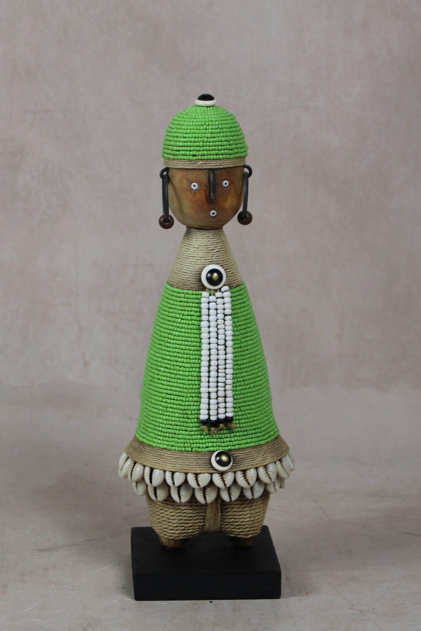 Hand-carved green beaded Namji doll from Cameroon