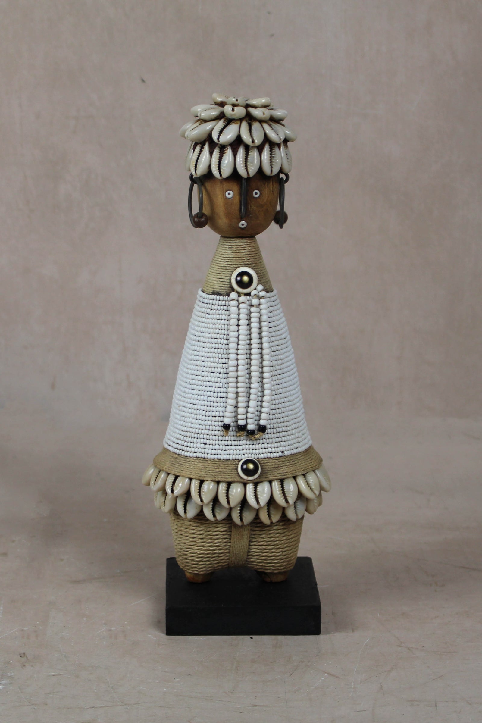 Hand-carved white beaded Namji doll from Cameroon
