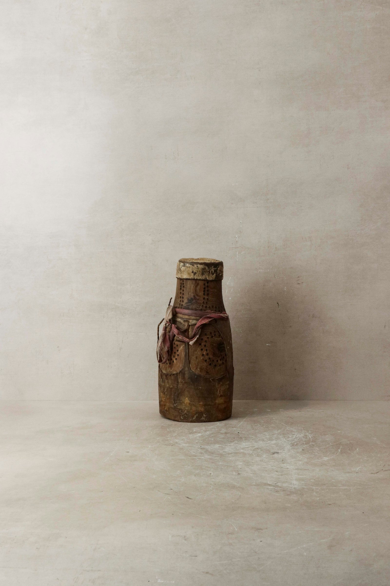 Vintage Turkana honey container hand-carved in Kenya with goat-leather detail