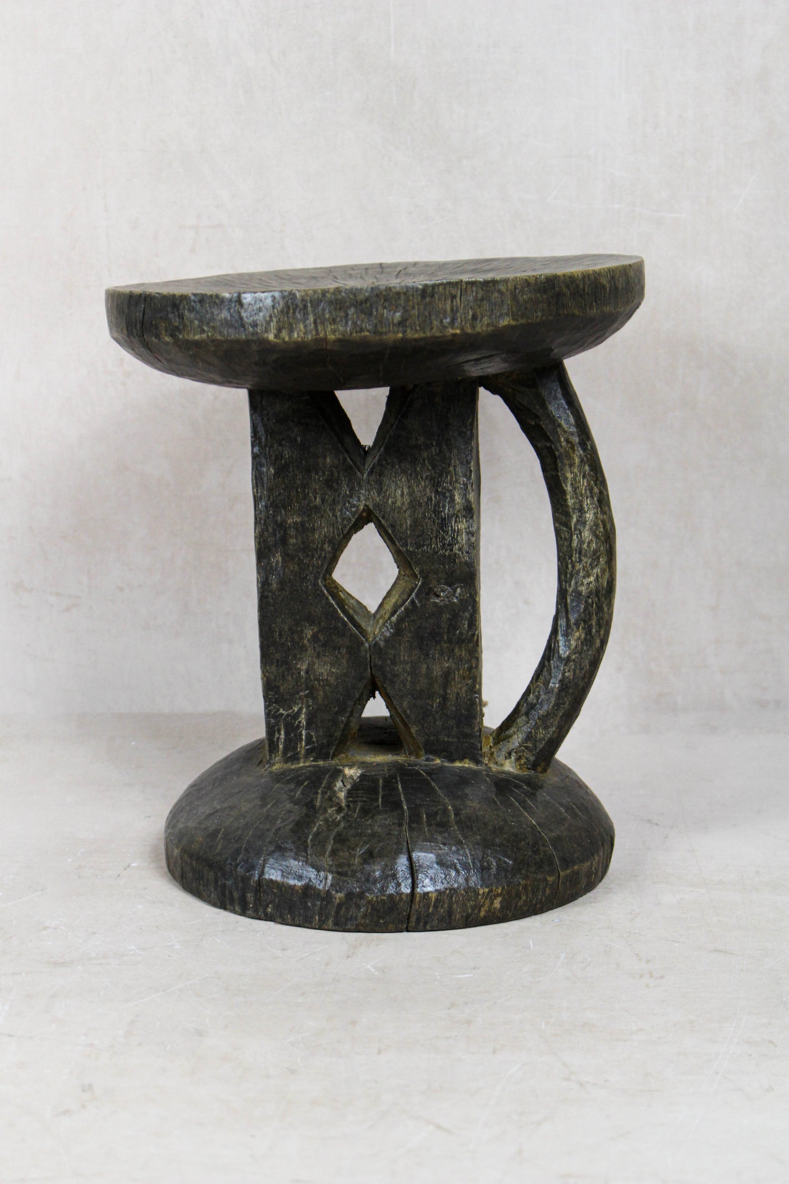 Small hand-carved Tonga stool from Zimbabwe in natural wood
