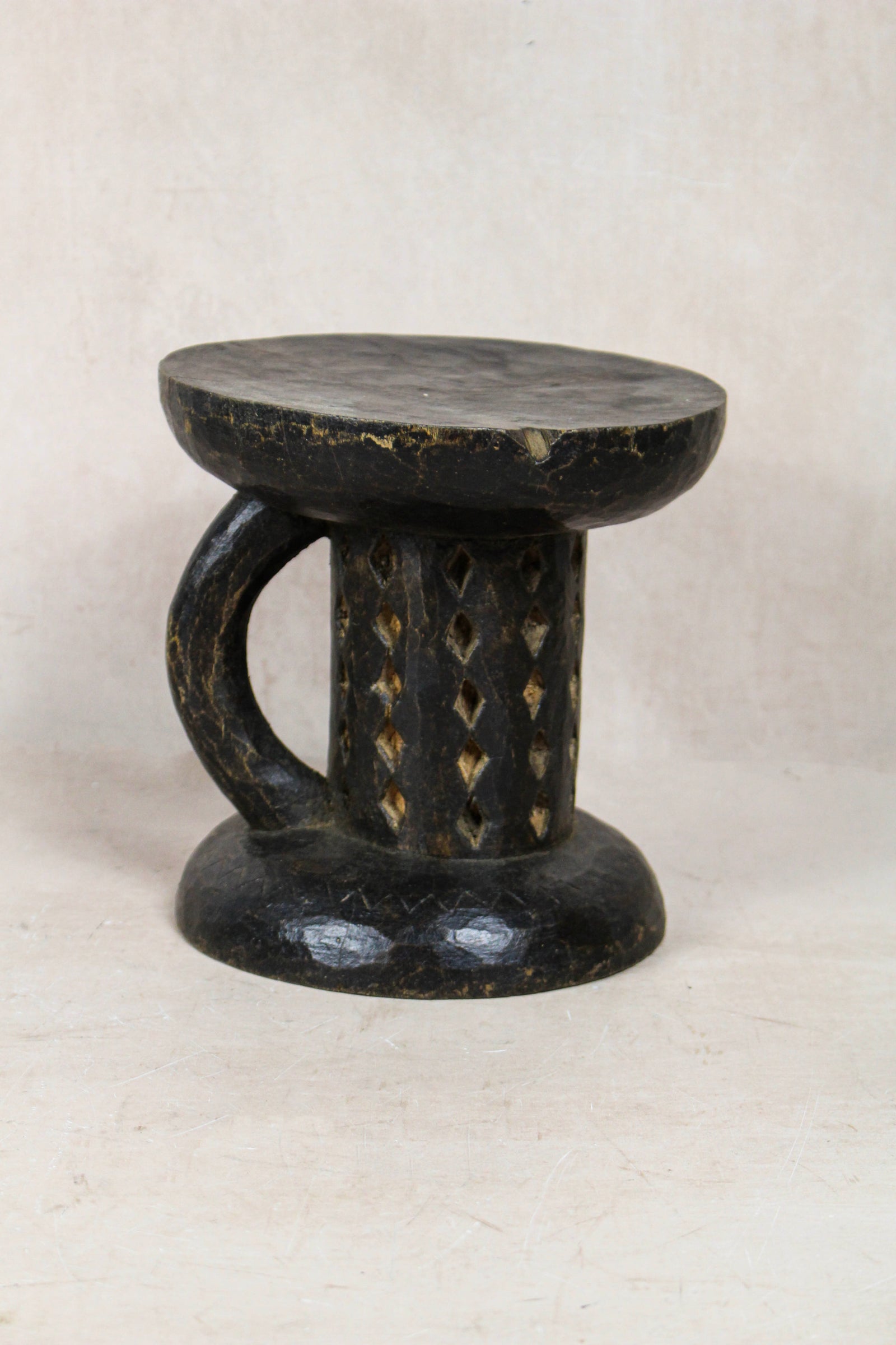 Small hand-carved Tonga stool from Zimbabwe in natural wood