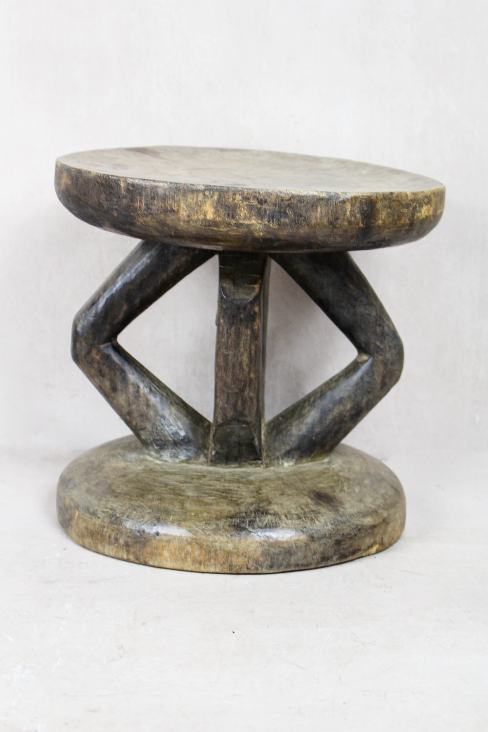 Hand-carved Tonga stool from Zimbabwe in natural wood