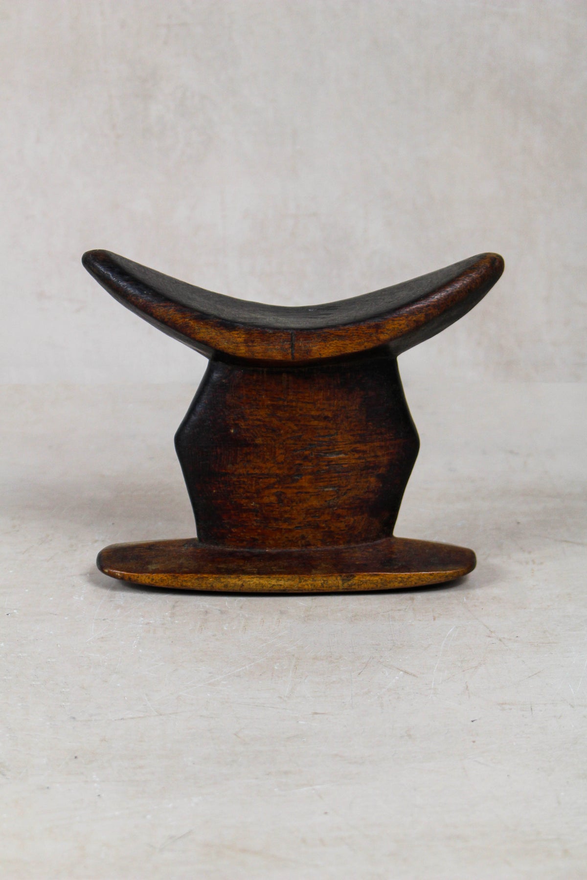 Vintage hand-carved Ethiopian wooden headrest in dark wood, sculptural African artefact (23.12)