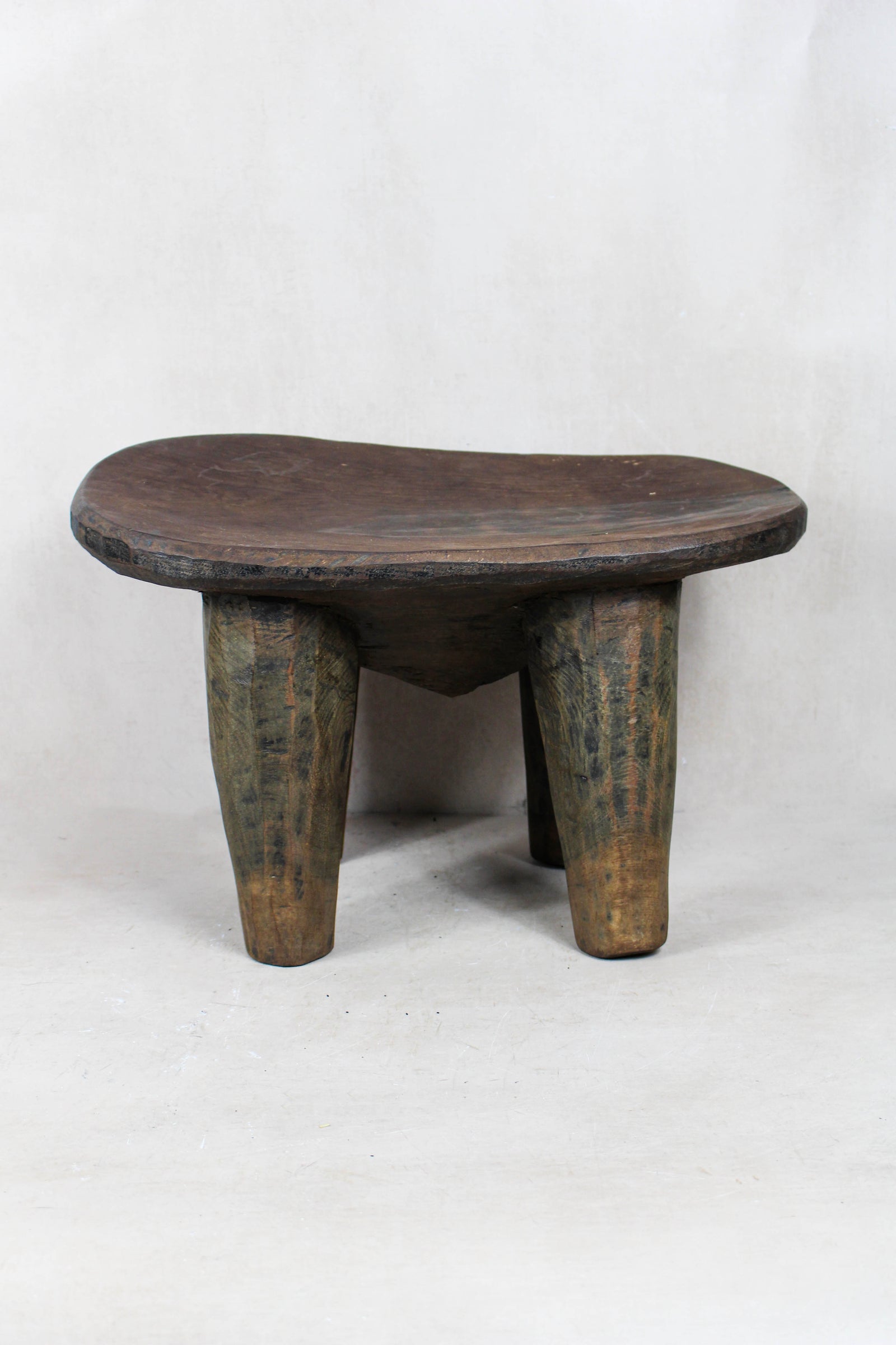 Small hand-carved Senufo stool in solid West African wood