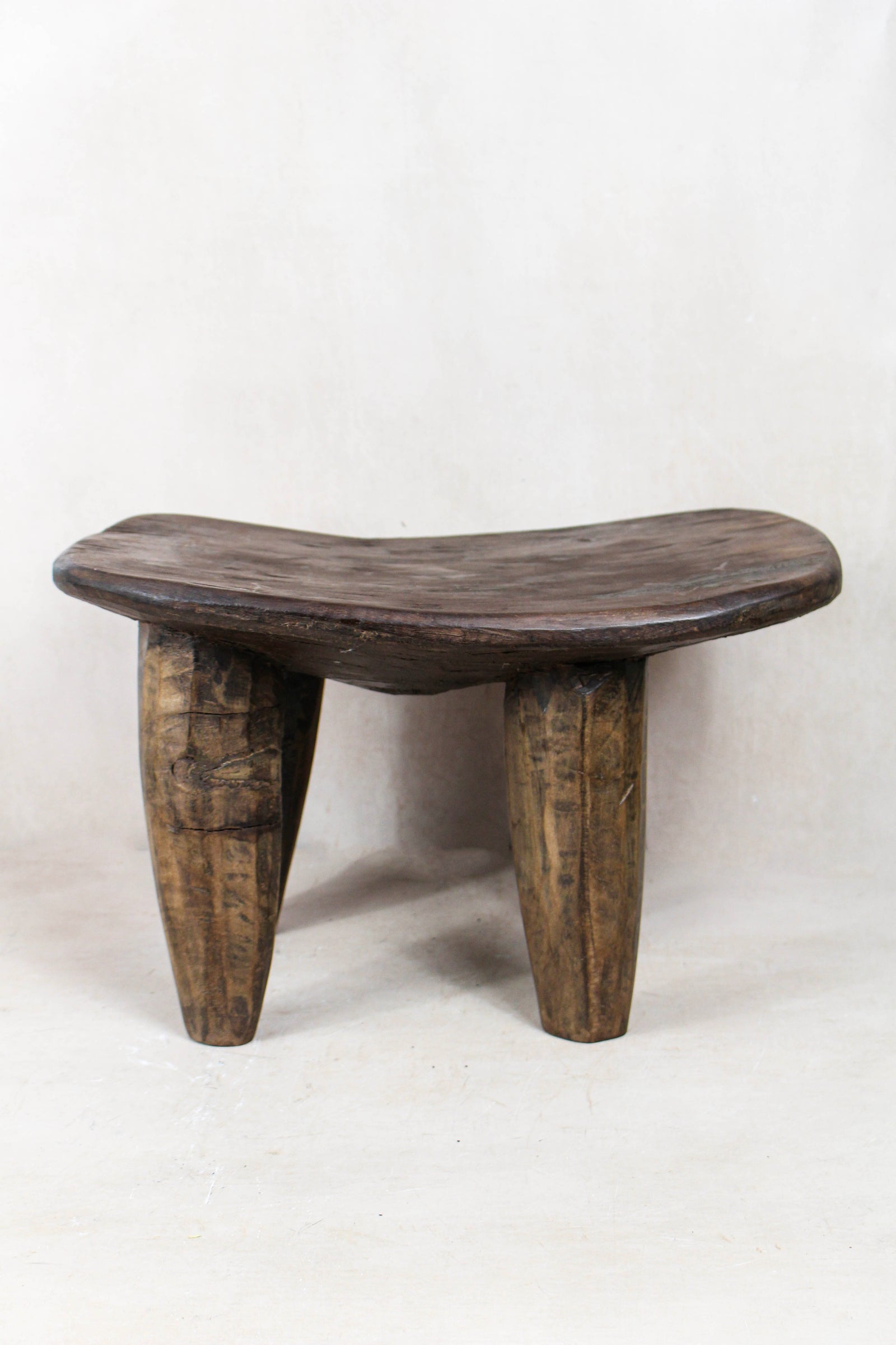 Authentic small hand-carved Senufo stool in solid wood