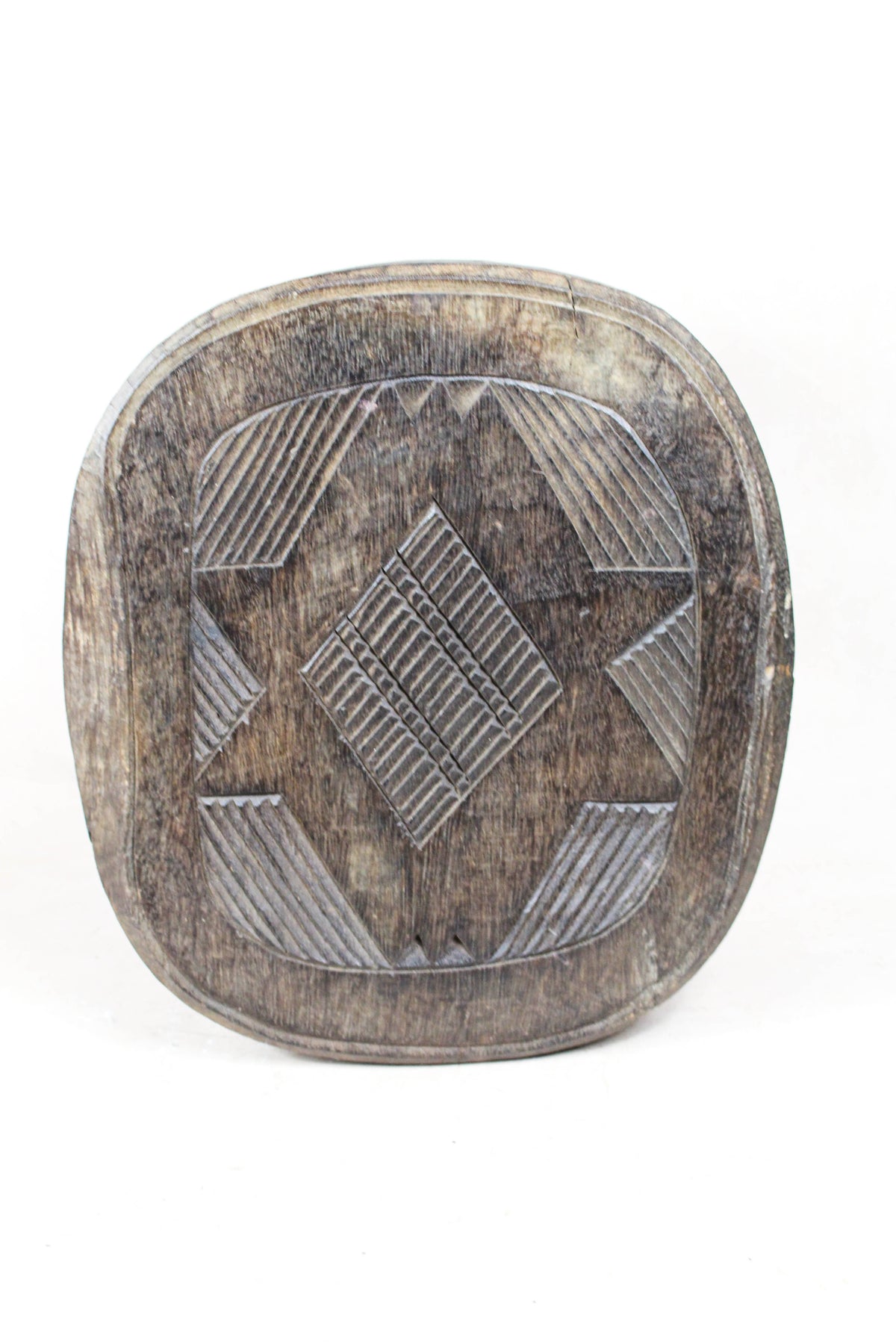 Nupe carved wood stool, Nigeria — side view