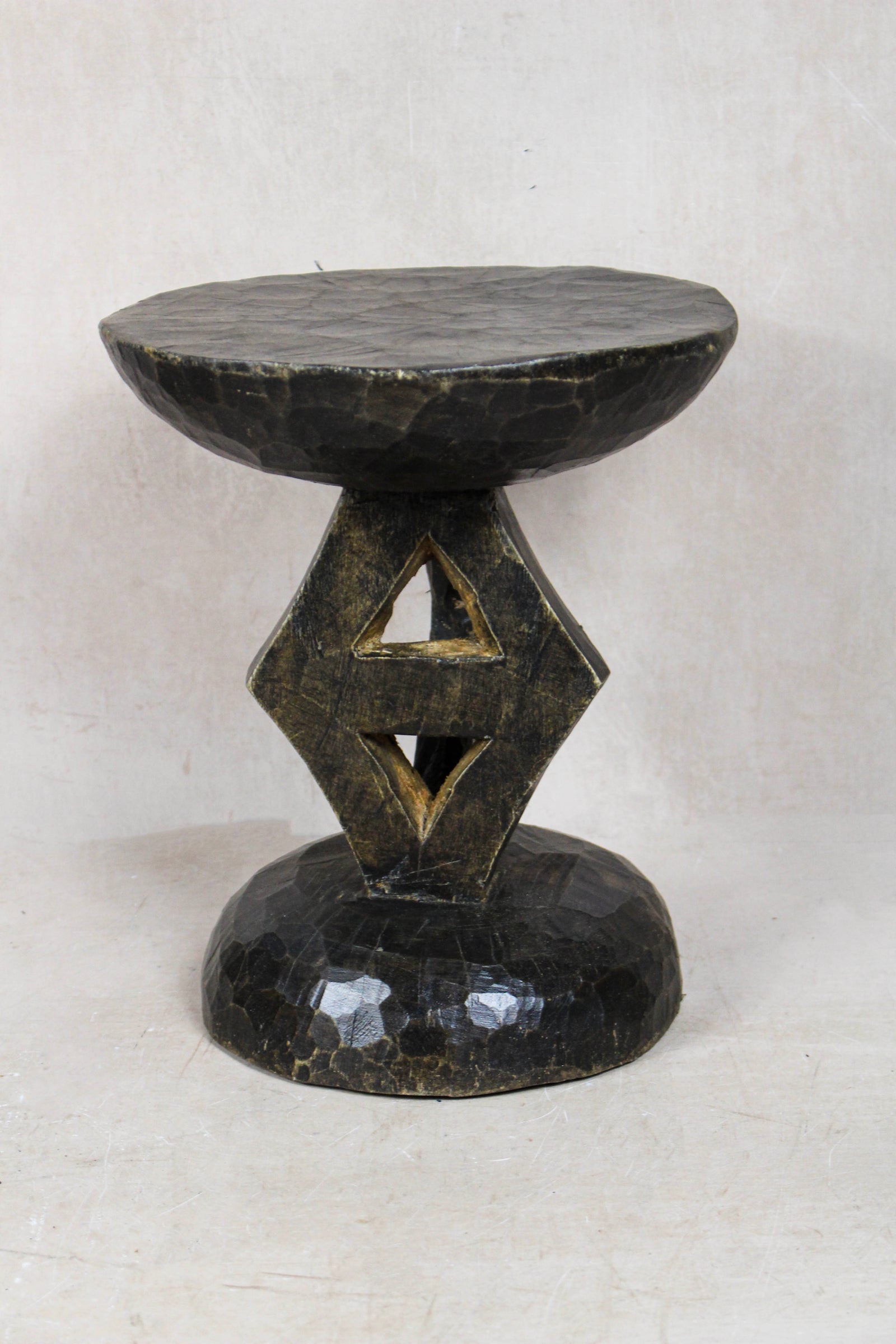 Hand-carved Tonga stool from Zimbabwe in natural wood