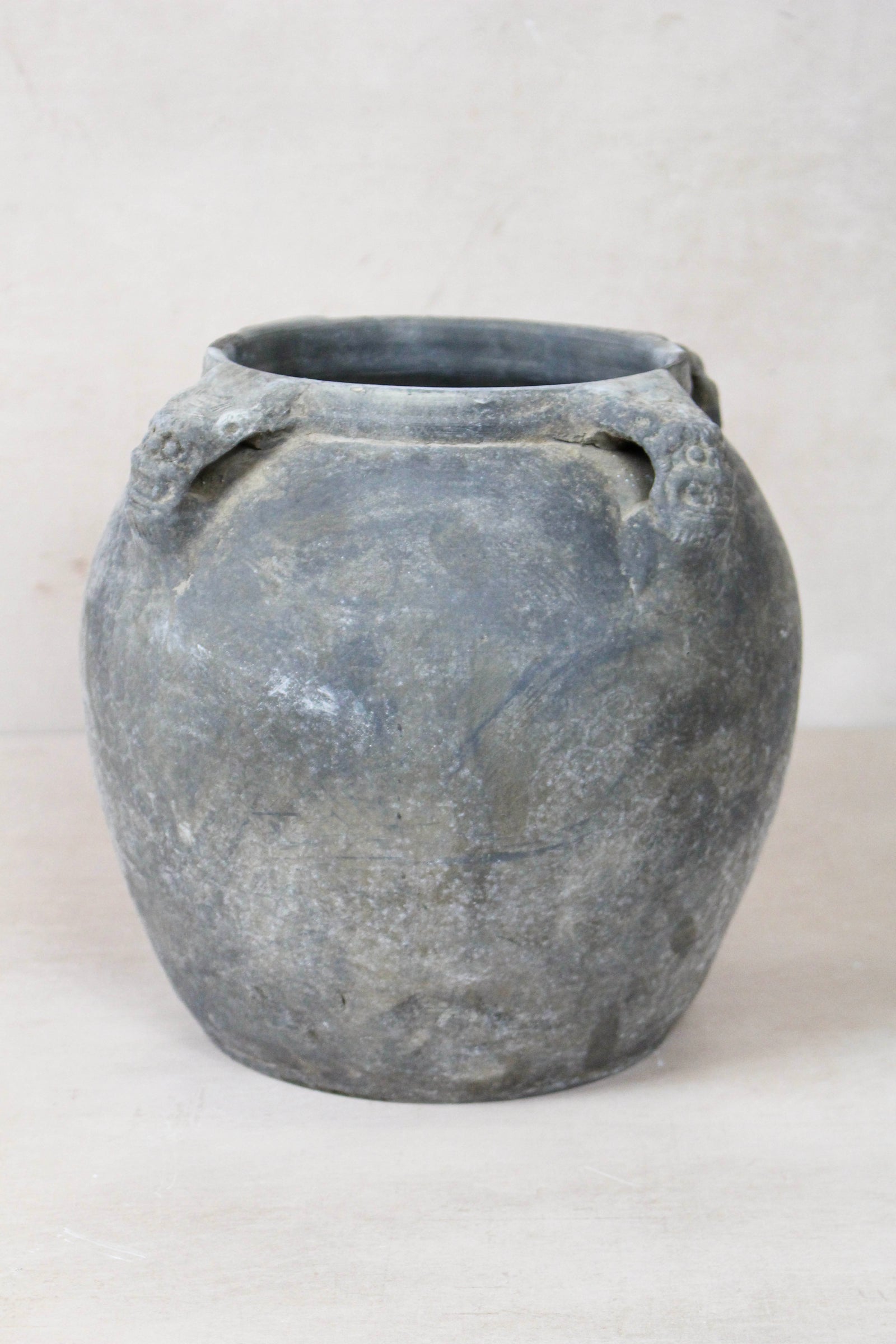 Vintage dark unglazed earthenware pot with lion-ear handles from Shanxi, China