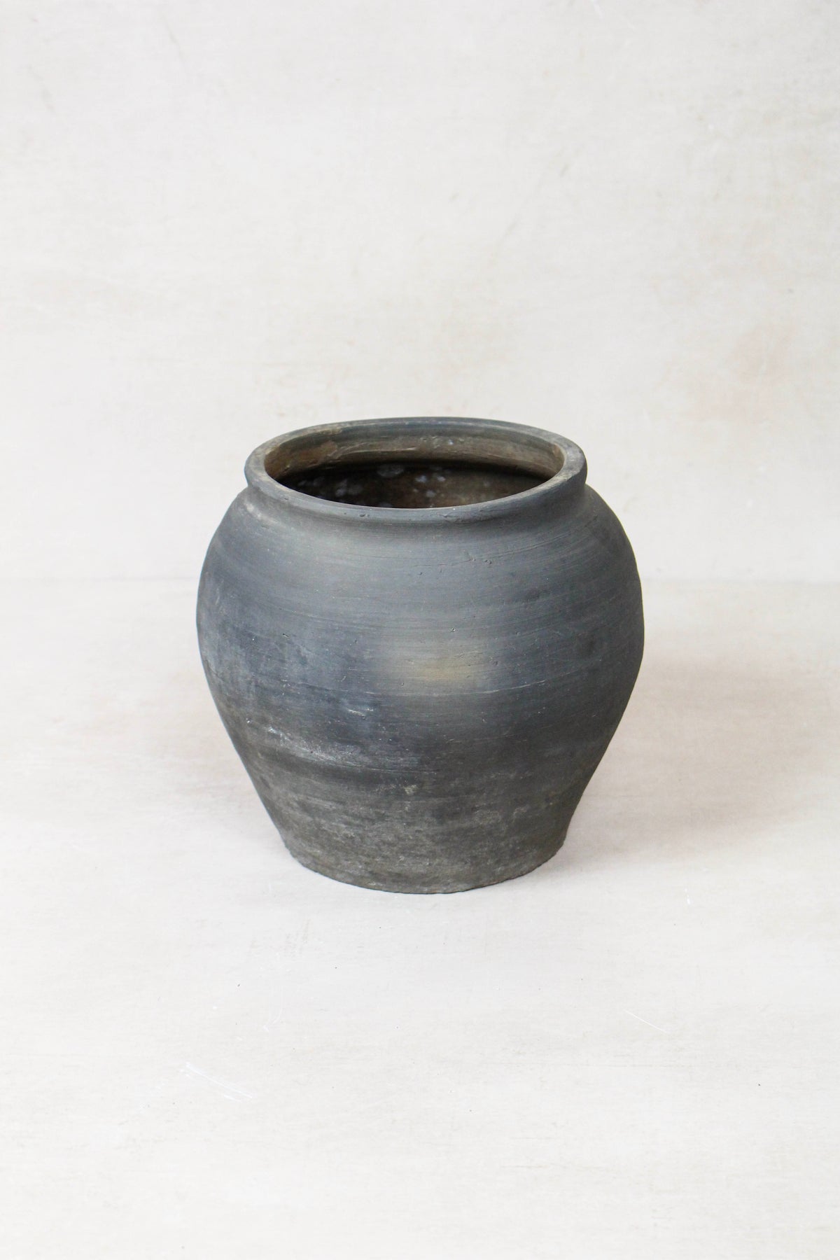 Vintage dark pot — detail of the surface