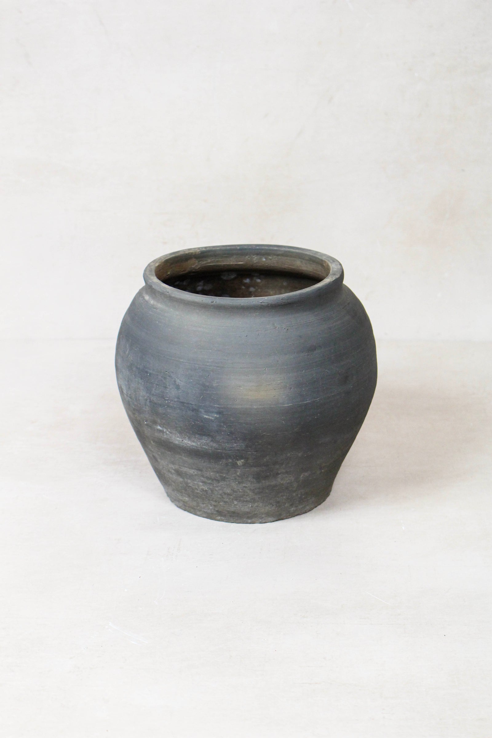 Vintage dark pot — detail of the surface