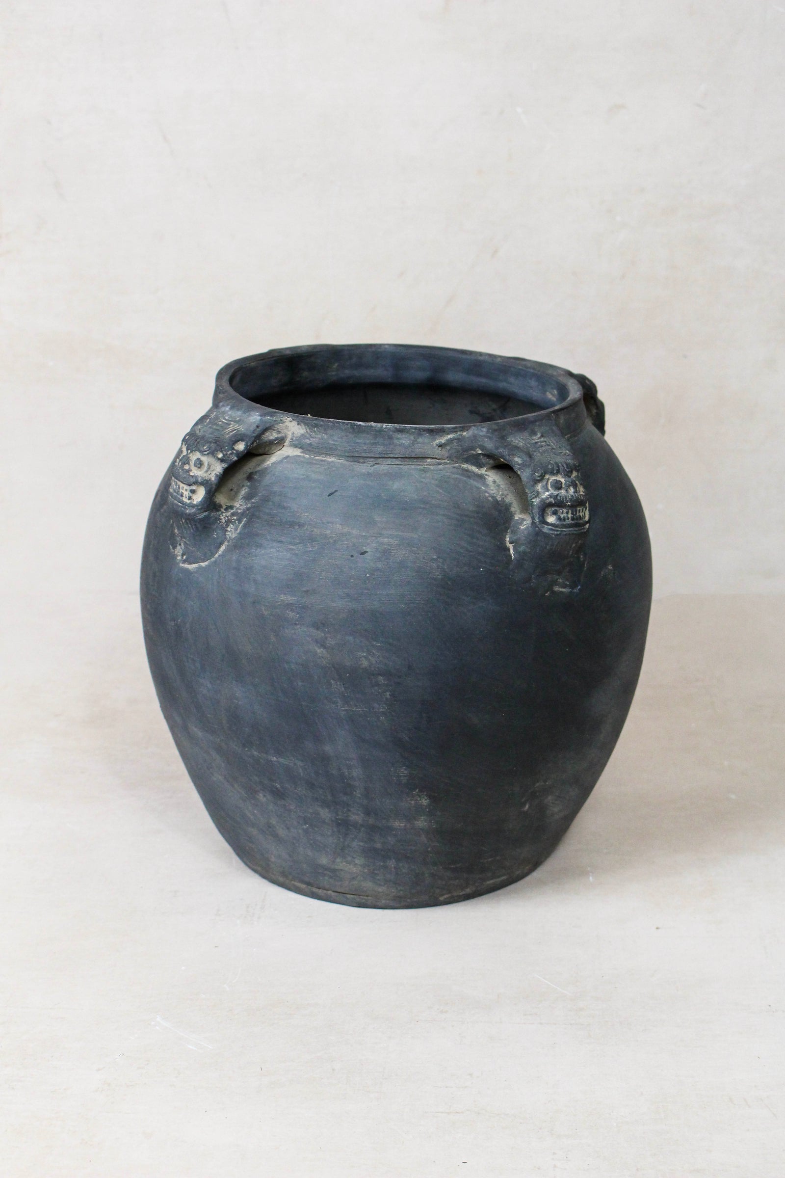 Vintage dark unglazed earthenware pot with lion-ear handles from Shanxi, China