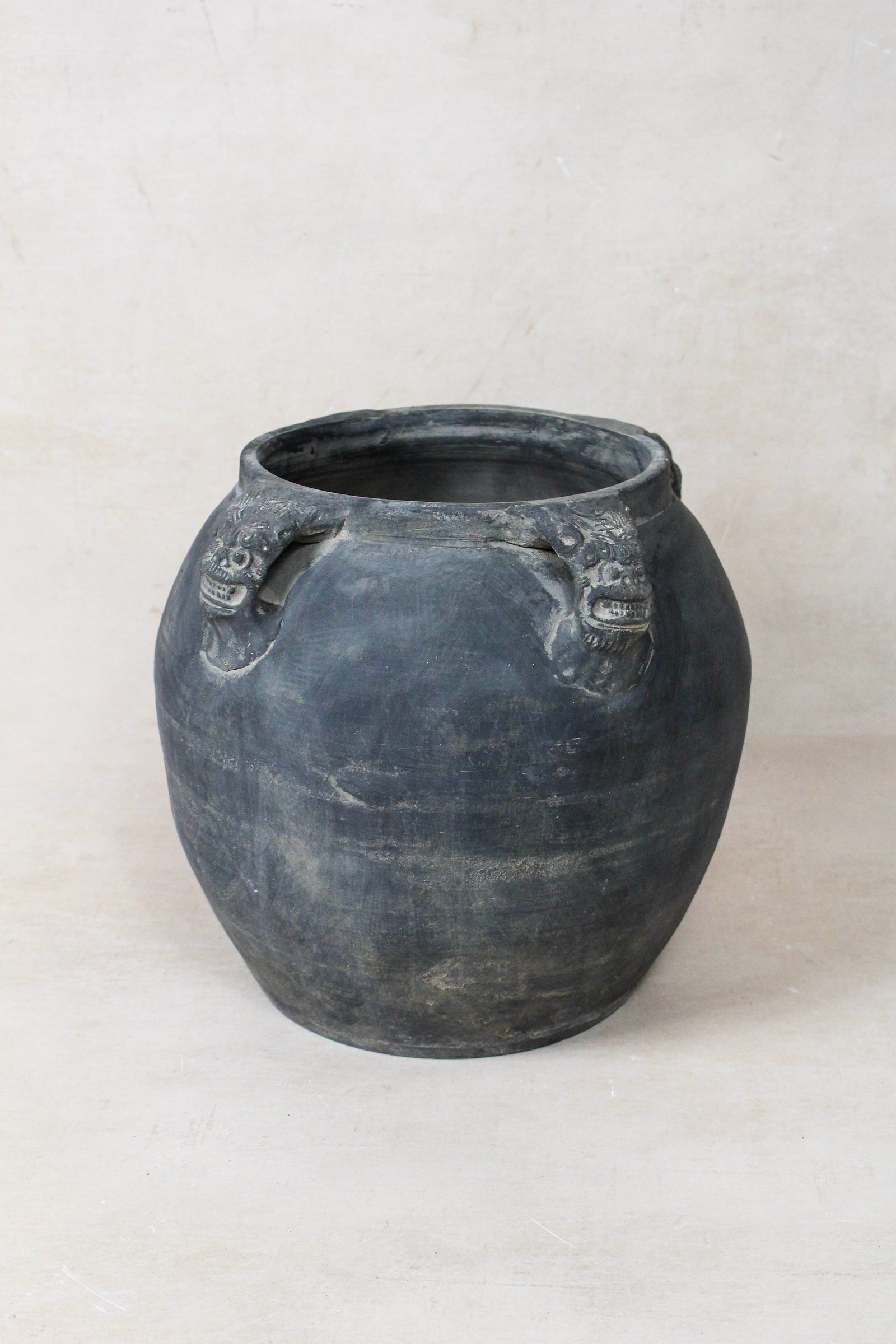 Vintage dark unglazed earthenware pot with lion-ear handles from Shanxi, China